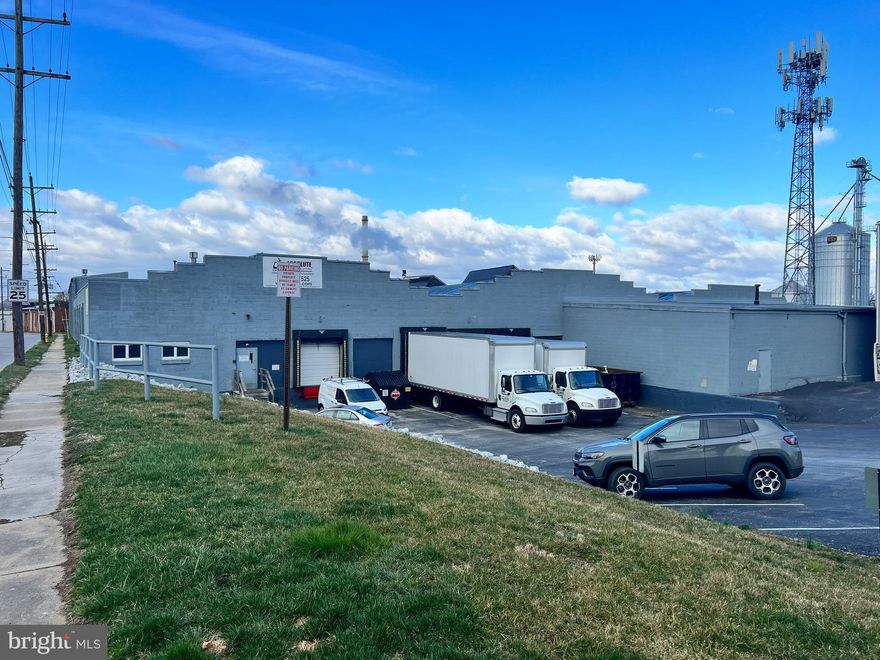 This functional industrial building features a small office space, restrooms, eight dock doors with two levelers. Six docks are located at the front of the building. Two are located in the rear. Other features include 1 drive-in door, concrete floors, heavy power, 12'-20' ceilings, & skylights that provide natural light The property is located along the rail line and at one point had a spur that went to the
building.