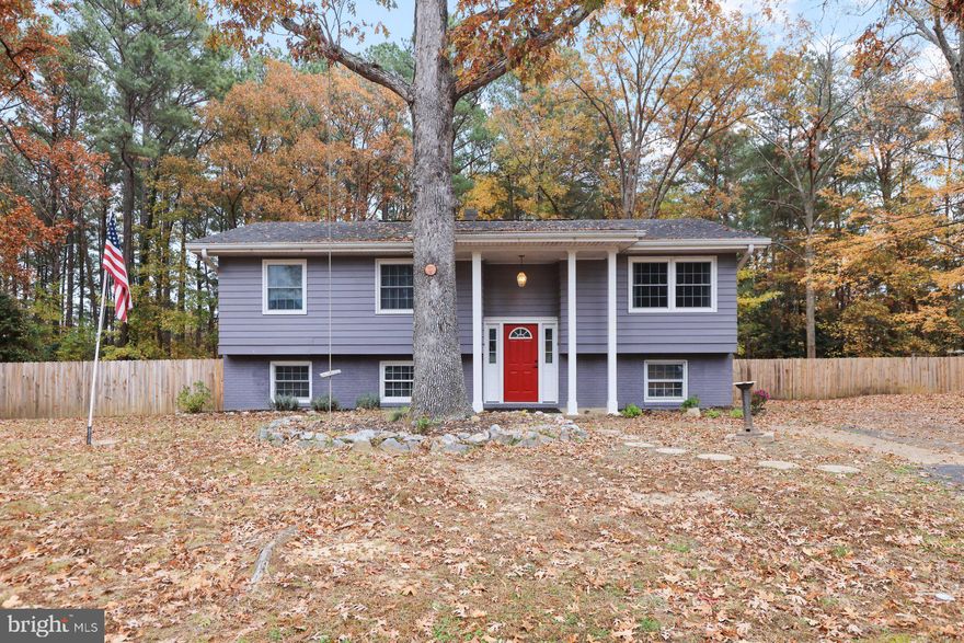 Move in ready, adorable, and fully renovated interior in 2020!! This four bedroom three bath home offers beauty, functionality and ample space for your family!! Conveniently located near Pax River NAS and shopping, this home sits on a large lot with a fenced in back yard, large deck and paved patio for entertaining! Beautiful blond hardwood floors throughout main level, luxury vinyl plank in basement, new paint, new stainless appliances, kitchen island, tiled bathrooms and all new electrical and panel are just some of the amazing features  of this home. A first time homebuyer's dream,  this home is move-in ready on public utilities and NO HOA.  Won't last....book your showing today!!