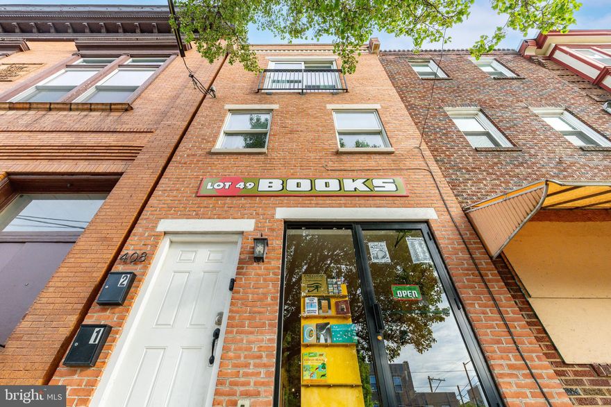 Situated along the vibrant Girard Avenue corridor in the heart of Fishtown, 408 E Girard Avenue presents a prime mixed-use opportunity with strong in-place income and long-term upside.

The first-floor commercial space is home to Lot 49 Books, a well-established bookstore with excellent street presence and consistent foot traffic. The space is approximately 700 square feet, plus a full basement of roughly 650 square feet with high ceilings—ideal for storage or additional use. The commercial lease is in place at $1,600/month. The Rent in this unit will increase to $1,800/month on 9.1.26, with $100 annual increases and runs through August 31, 2031, offering stable, increasing income.

Above, the bi-level residential unit features 2 bedrooms and 1.5 baths with a thoughtfully designed layout and quality finishes throughout. The front bedroom includes a Juliet balcony overlooking Girard Avenue, while the rear bedroom opens to a large private deck. The unit is currently leased at $2,350/month through July 31, 2026, with flexibility for a buyer to either occupy or continue leasing for additional income.

Positioned in one of Philadelphia’s most sought-after neighborhoods, the property offers immediate access to Fishtown’s renowned dining and retail scene, as well as convenient connectivity to Center City, I-95, and public transportation.

A versatile asset well-suited for investors seeking stable returns or owner-users looking to occupy while benefiting from supplemental income.