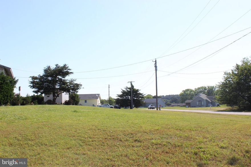 3/1601 Elevated, cleared corner lot with conventional septic system already installed with some views of Swan Gutt Creek in the distance. Lot has water availability and could possibly be connect to sewer with approval from AQUA VA. ESBVA. This lot is in a highly sought after area of Captains Cove, just a short distance to all the amenities. Buy now and build later, take advantage of this great buy! No time frame to build, and no Builder Tie-In. Enjoy all the amenities and the lifestyle on the Eastern Shore of VA. Close to Chincoteague Island, Wallops Island and Ocean City MD. HOA amenities: 9 Hole Pristine Golf Course, indoor/outdoor pools (2), fitness center, basketball & pickle-ball courts, biking & walking trails, boat ramp, docks, playground,dog park, picnic area, security and so much more.