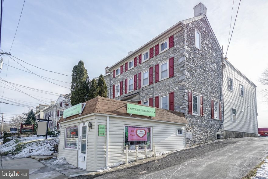 This commercial property is strategically located in a thriving Business District, offering significant investment potential. The current owners have done all capital improvements including kitchens with microwaves and dishwashers, baths and each apartment has its own laundry. The combination of location, accessibility, and low operational costs makes this an attractive opportunity for savvy investors looking to expand their portfolio in a high-demand market. Tenants pay both heat and electric. Parking lot.  Building is 100% rented. Photos show apartment prior to occupancy. Make this your next investment!