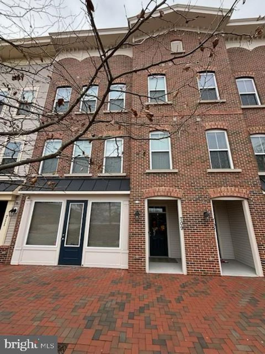 Welcome to 709 Skippers Lane, a rare and versatile Live/Work townhome in the sought‑after Village Greens community—one of the only  homes in the development offering this unique zoning flexibility. With 3,016 sq. ft. of beautifully finished space, this contemporary residence blends upscale living with the opportunity to operate a boutique business, studio, or professional office right from home.  Step inside to discover a thoughtfully upgraded interior featuring designer touches, abundant natural light, and an open-concept layout ideal for modern living. The gourmet kitchen, spacious dining area, and inviting living room create a warm and functional environment perfect for everyday comfort or entertaining.  The home offers three spacious bedrooms, two full baths, and two half baths, including a serene primary suite with generous closet space and a well-appointed en‑suite bath. Every level has been meticulously maintained, reflecting pride of ownership throughout.  A new AC unit was installed in Oct 2025.  The garage is painted and that floor has high temp epoxy. The street-level commercial space—previously home to a boutique yarn and knitting shop—opens the door to endless possibilities. Whether you envision a specialty retail shop, creative studio, office, or an expanded living area, this flexible zone empowers you to live, work, and play without compromise. Perfectly positioned just minutes from historic downtown Annapolis, major commuter routes, shopping, dining, and the waterfront, this home offers the ideal blend of convenience and charm.