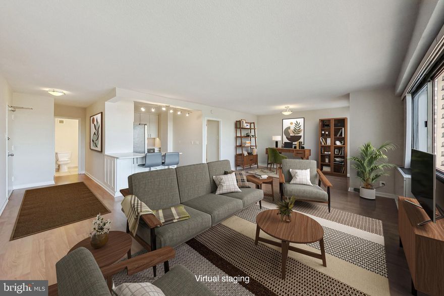 The Willoughby is the consummate care-free living experience! This unit is move-in ready, with all the right updates. The open kitchen features full-size stainless steel appliances, quartz countertops, and a breakfast bar. Laminate flooring throughout the unit gives it a modern look. This light-filled unit is big enough that you could easily carve out a den or second bedroom and still have plenty of living room space. The dual entry bathroom has two sinks and vanities, providing an extra bit of privacy. The location is top notch, in the heart of Friendship Heights, with a plethora of upscale retail options, including Bloomingdale's, Tiffany's, Whole Foods Market, dining choices from Chipotle to Clyde's, and the metro just 1/4 mile away. The lobby is currently being renovated, and when finished will make the building even more attractive. Reserved garage parking and a 24-hour front desk add to the convenience and security. Unit is also listed for rent.