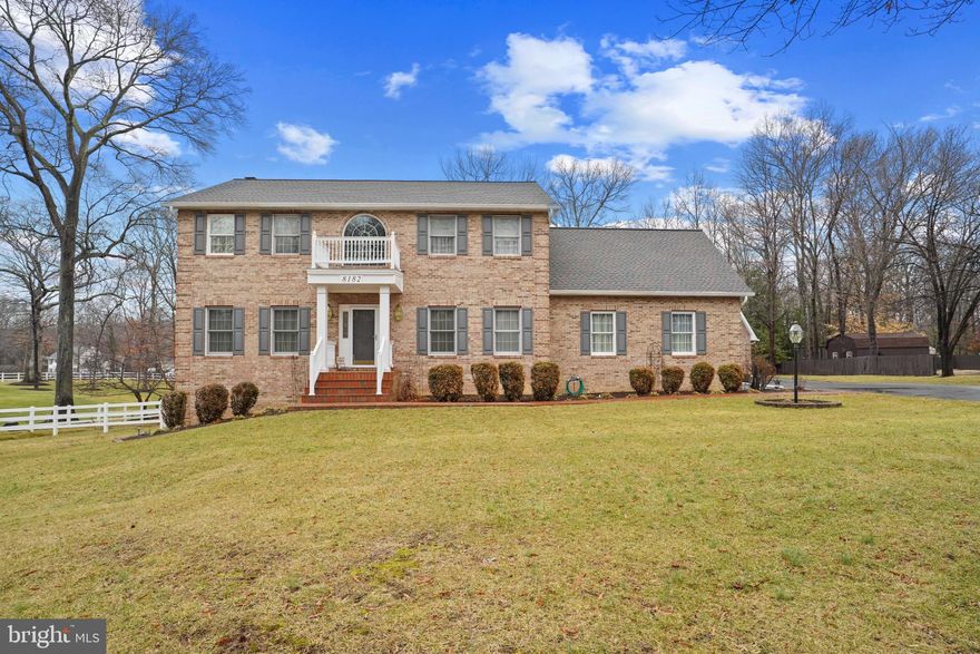 Original owners.  This custom, all brick, colonial, was built with every detail thought through.  From the dimmer switches & crown/chair molding throughout, to the drop down chandelier in your foyer, for easy cleaning, or changing of light bulbs.  To the wireless alarm, dual ovens, 6" gutters, central vacuum, oversized pressure tank & hot water heater.  A fresh air intake, ash catch (inside and out) and custom mantel over the cozy wood burning fireplace.  You'll notice the pride in ownership the second you pull in.  Professional landscape and yard maintenance agreement.  Calling all mechanics, boaters, or campers...Attached, side load, two car garage offers ample space for the everyday vehicles, while the oversized detached garage comes equip to park the RV, boat, additional vehicles or any other toys.  Let your dreams run wild with the additional space above the detached garage.  Perfect to complete for an apartment, home business or use as is as a work shop, storage or craft room.  The possibilities are endless and potentially income producing!  Hardwood flooring, 42" cabinetry, & granite highlight the main floor/eat in kitchen.  Oversized primary bedroom with remodeled bathroom and huge walk-in closet.  Fully finished walk out basement with wood stove.  Tastefully decorated and meticulously maintained.  Truly a must see.  Welcome home.