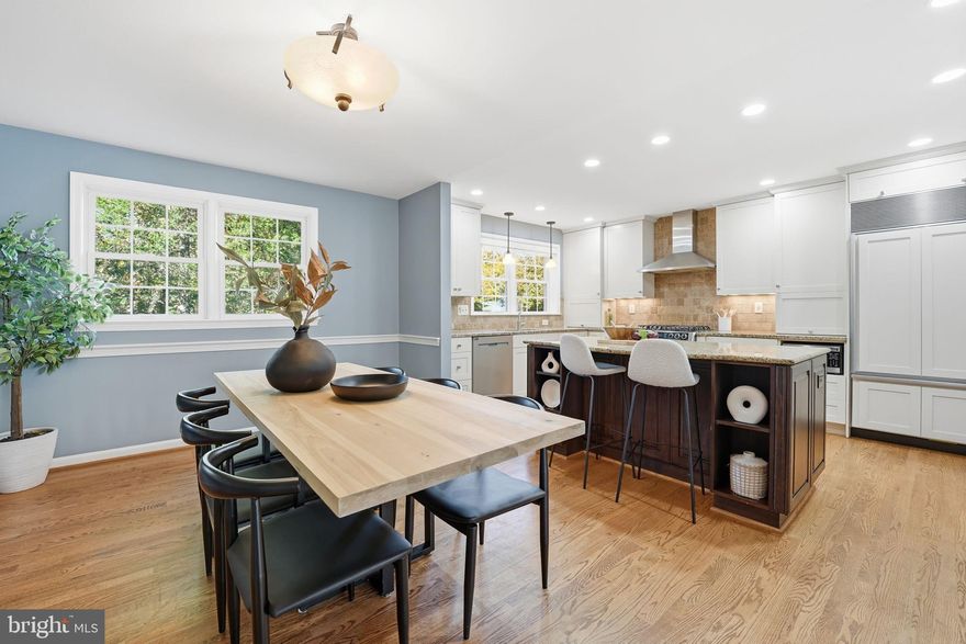 Incredible opportunity to own in Vienna's Merrifield View, a peaceful enclave of 83 solidly built but rarely available all-brick townhomes!  Located just blocks to Mosaic District, Dunn Loring Metro, and with ease of access to the heart of Vienna, Tysons Corner, and Fairfax, 2804 Lafora Ct offers a truly unbeatable location.  Step inside to find a spacious 2,100+ square foot floorplan unlike any other complete with a stunning chef's kitchen that rivals detached homes in both size and finish quality.  From the tasteful two-tone cabinetry, large center island with seating, slew of oversized drawers and storage spaces, to the stainless steel range hood, cabinet-paneled Sub Zero refrigerator/freezer, built-in spice rack, under cabinet lighting, and so much more, this gourmet kitchen is truly the heart of the home.  The adjoining, expansive dining space flows seamlessly into the sunken living area with a series of custom built-ins on either side.  Solid plank Oak hardwoods span the entire main level and updated, double pane Andersen windows filter through a tremendous amount of natural light.  The separate foyer, half bath, and coat closet round out this level of the property.  Upstairs you'll five a massive owner's suite with young ceiling fan, custom window coverings, double closets (both with upgraded organizers!), and an updated ensuite bath with added lighting and pocket-door.  Two nicely sized secondary bedrooms with upgraded ceiling fans, an upgraded hall bath, and a HUGE linen closet complete the top floor.  Heading to the lower level you'll find an invaluable fourth bedroom/flex space!  Filled with natural light this is the perfect spot for guests or a home office.  An additional ample size rec room featuring a full walk-out to the rear patio (by way of an upgraded sliding glass door with interior window treatments) includes a fireplace with gas logs, upgraded lighting, and tons of opportunity for a flexible lower level living area.  A large storage room, laundry area with utility sink, under stair storage, and a half bath can also be found on this versatile lower level.  When you're ready for some fresh air, step outside to your fully fenced-in backyard retreat with private views and bistro lighting -- perfect for al fresco dining, entertaining, or peaceful relaxation.  In addition to the many perks of this central location, parking is a breeze!  With one assigned parking space, TONS of unmarked spaced within the lot that are first come first serve, and full-time open street parking just steps away, there is a plethora of parking options for you and your guests.  NOTABLE DATES: Freshly painted top-to-bottom (2025); All new bedroom carpeting (2025);  Upgraded/Added Lighting (2025); New dishwasher (2022); New water heater (2020); Chimney repairs and new crown (2019);  New Washer and Dryer (2019); Updated double hung vinyl replacement windows; Roof age estimated at 6-9 years, architectural shingle;  Carrier HVAC (2013) but new flue (2019)