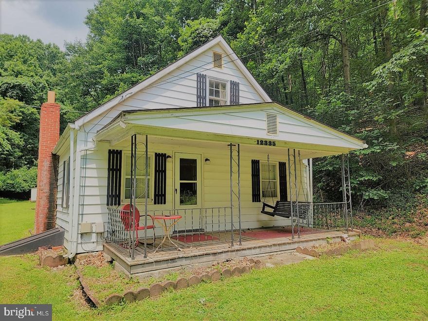 Back on market---buyer's financing fell through! Three will be the charm!!!!!

PLEASE NOTE!! IN DOING THE SURVEY IT WAS FOUND THAT THERE IS A 20 FOOT RIGHT OF WAY ON THE PROPERTY. BRAND NEW  SURVEY AVAILABLE. 
CAUTION: THIS PROPERTY itself IS NOT FOR EVERYONE!!! HOWEVER, if you are looking for seclusion and peace and quiet--this may be exactly what you want.  Think about an already built tiny house---it needs work and TLC, but if you would like to have a weekend get away, a full time home with  lots of wooded acrreage, or a beautiful spot to build a new house or put an addition on this house--it really doesn't get much better than this!!!  A short drive to I-68 (maybe seven to 10 minutes tops) and at the utmost 10 minutes into town, you don't sacrifice cilvilization , but instead have your own private paradise so close to the real world .  Home is conveyed in  AS IS condition.

Keep in mind that it does need work, but if you are a handyman or lady--take your time and make it ideal for your living circumstances. It also important to tell you that some lenders may not  lend on the property, however, there are a few who will...check with your agent or this agent.
-it was just surveyed last week, too and it was discovered that there was more land there than was once thought. 
So, whatever your haves, wants , and needs, this little property may be just the place you have been looking for.....please remember that the property will convey in absolute AS IS condition--seller does not warrant it.