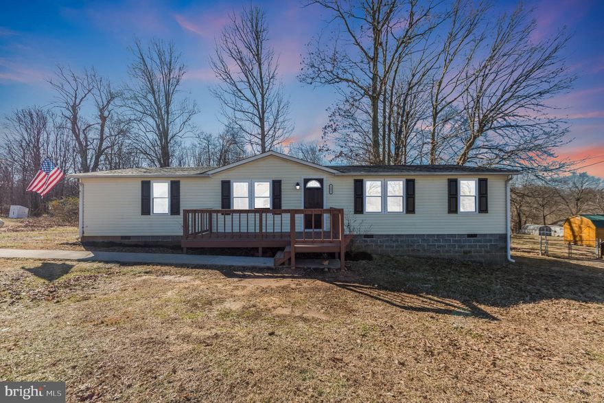 Welcome to refined country living in this fully renovated 4-bedroom, 2-bathroom manufactured home situated on 1.3 acres of picturesque land. Spanning 1540 square feet, this home has undergone a complete transformation, boasting a new roof, HVAC,windows, flooring, and contemporary light fixtures throughout, marrying charm with functionality seamlessly. The kitchen stands as the epitome of modern elegance, featuring all-new soft-close cabinets, granite countertops, and a captivating tile backsplash. Step outside onto the rear deck, offering the perfect spot for al fresco dining or simply unwinding while enjoying the serene surroundings. Embrace the tranquility and comfort of this thoughtfully revitalized residence, where every detail exudes sophistication and style.
