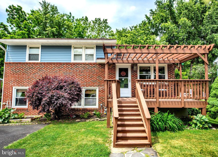 Spacious split level home located in Glenside Park. The beautiful living room/dining room on the main level complete with a gourmet kitchen including a large island/breakfast bar with stunning granite top, granite counters and stainless steel appliances with extra refrigerator. Sliding glass door to 14 x 10 deck, great for entertaining! The upper level hosts 3 bedrooms and 1 full  bath, completely updated. Primary bedroom has slider to 15x13 upper level deck. The lower level offers a family room, upgraded full bath with walk-in shower, an additional bonus room, and laundry room. Extra long driveway, room for 6+ cars.  Backyard has plenty of space and backs to trees. 12x8 shed included. New roof, 6 years ago. Inviting front porch with pergola. A must see!