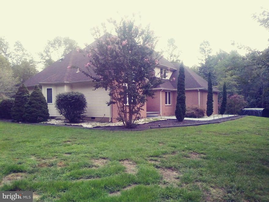 Beautiful custom home on over 5 acres well maintained contemporary style with many upgrades including new wood floors, new master bath, new roof, the ac units and heat pumps, septic system and hot water heater is all 5 yrs old. The home has 4 bedrooms and 2.5 baths, large deck overseeing back yard with pool and 20ft by 16ft out building, about 1 ac cleared land and the other 4 wooded lots of privacy and nature and a stream. The lower level bedroom has a private entrance off the driveway . There is an unfinished bonus area in large attic. Plenty of privacy yet close to shopping and commuter parking the kitchen and family room separated with see thru gas fireplace. All exterior walls are 2x6 construction. Situated a short distance from Golden beach. Home Warranty Included.