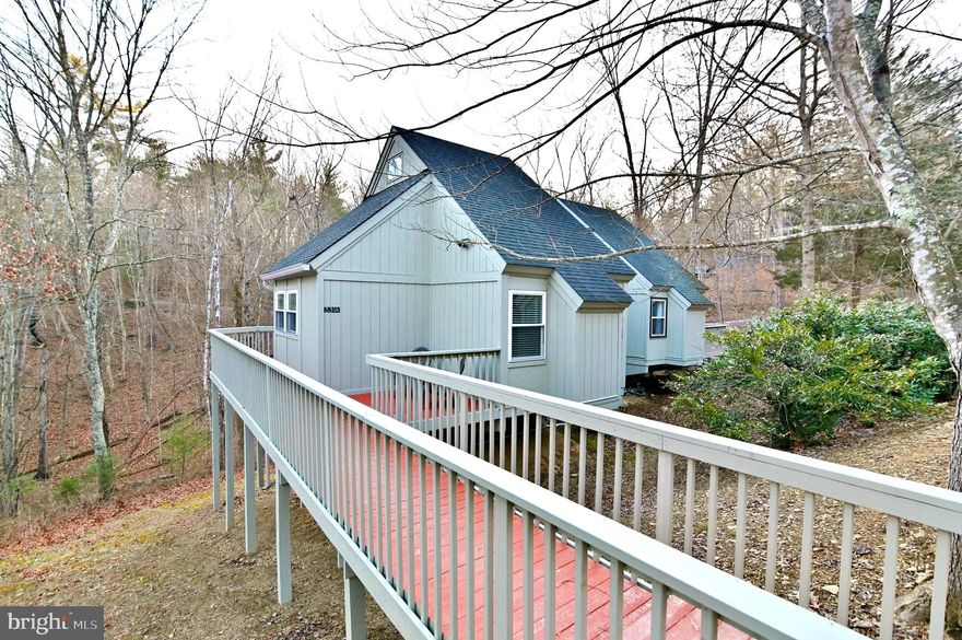 Nestled in Basye, VA, this 724sq ft charming 3-level townhome is part of the sought-after Lakeview Pedestal Homes, just a stone's throw from the four-season Bryce Resort. With 2 bedrooms and 1 bathroom, this home is perfect for full-time living or as a vacation retreat. Over the past four years, the property has been tastefully updated with new appliances, including a fridge, glass-top stove/oven, microwave, washer, and dryer. The main floor features new windows, new front door, and new storm door, along with new slatted wood blinds and new wood flooring. The loft boasts new tile and a ceiling fan, while the main floor bedroom has been enlarged, and the bathroom updated to include a large walk-in shower with a tile floor. Comfort upgrades include a new HVAC system, new hot water heater, and a new vented Vermont Castings propane fireplace. The exterior has been freshly painted, along with the interior, including the ceiling and beams. A new deck has been added to the lower level, and some new exterior decking has been installed. The basement has a new ceiling and flooring. Additional features include a wall-mounted electric convection panel heater in the bathroom. The property comes fully furnished, including a TV in the living room, a firepit with outdoor chairs, building materials (lumber, tile, flooring, paint, etc.), and various tools (construction tools, garden tools, ladders). Renovations included plumbing and electrical work during the redesign of the bedroom, bathroom, and kitchen which was completed by a professional contractor.