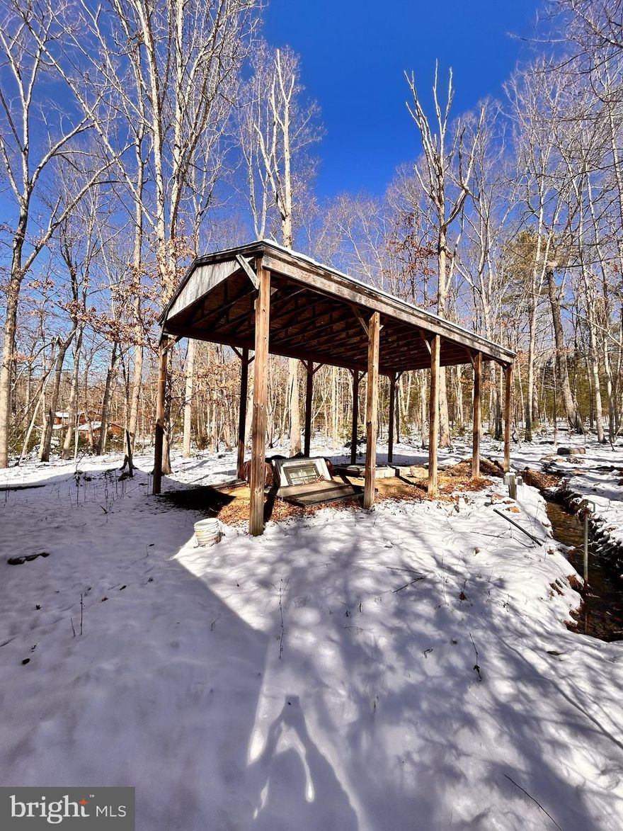 Discover this charming property nestled on a level 2.47-acre lot bordering the George Washington National Forest. With the wet-weather stream that runs through the property, the landscape creates a peaceful ambiance. Situated in Evergreen Farms, a tranquil and welcoming neighborhood, this location offers the perfect blend of nature and convenience. Located not far from Wardensville, WV, residents have easy access to local amenities, including an organic farmers market, new dining spots, cozy cafes, and boutique shops. Plus, enjoy the convenience of high-speed fiber optic internet availability. Don't miss out on this incredible opportunity! Schedule your appointment to view this property today.