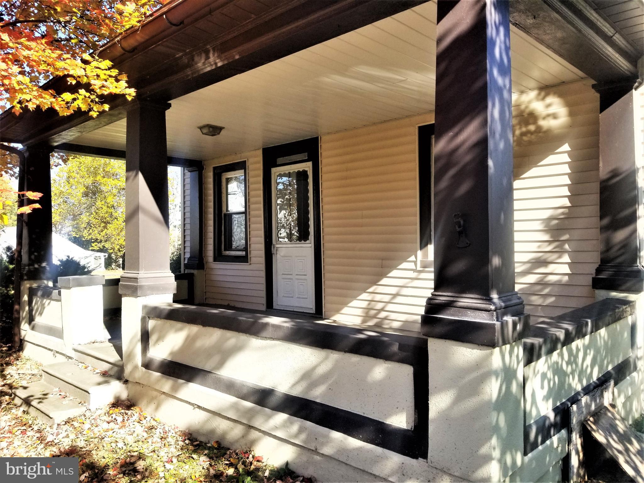 1st floor 1BR Apartment w/In Unit Laundry on 2.6 acre lot on the country. Parking lot on site.  Stocked fishing pond at the rear and plenty of room to roam. Large Living room with door to covered Front Porch. Nice sized Bedroom, Full Bath, Large Kitchen with Laundry Area. In good repair and comfortable. There is also a Refrigerator in the unit. There's big, open side yard for your outdoor enjoyment. This is a great country apartment.