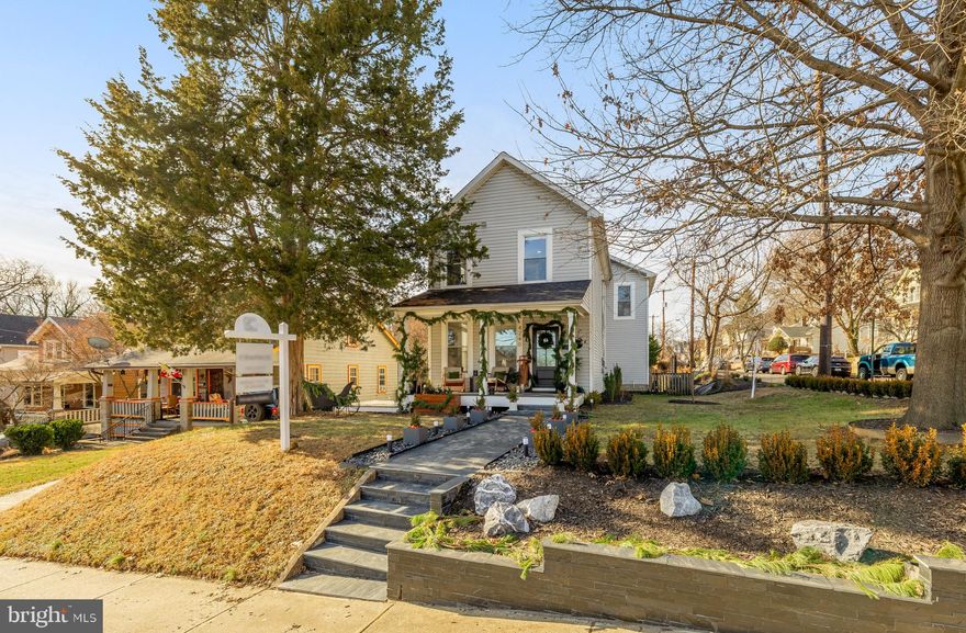 Welcome to 4240 34th St, a beautifully updated  2500 SF farmhouse nestled in the heart of Mount Rainier. Thoughtfully curated to blend modern sophistication with timeless character, this exceptional home stands out in one of the D.C. metro area’s most vibrant and desirable communities.

Upon entry, you are welcomed into a large dining room featuring a sleek, moody dry bar—perfect for intimate dinners or elegant entertaining. The space flows seamlessly into a spacious living room with multiple seating areas and a cozy fireplace, creating an inviting yet refined atmosphere. The living room opens to the beautifully appointed kitchen, complete with white cabinetry, granite countertops, stainless steel appliances, and a separate pantry. Bathed in natural light, the open-concept layout is both functional and stylish.

The upper level offers four well-appointed bedrooms, including a spacious primary suite with a luxurious en-suite bathroom. Each bedroom is filled with natural light, offers generous storage, and provides flexibility for a home office or guest retreat. A dedicated laundry room with side-by-side washer and dryer adds everyday convenience.

Throughout the home, new flooring, baseboards, trim, and doors enhance the clean, contemporary aesthetic. The main-level powder room has been fully reimagined, while the two upstairs full bathrooms have been tastefully updated with refined finishes.

Outdoor living is equally impressive. Situated on an oversized lot, the property offers a rare sense of privacy and versatility. The front porch has been elevated with durable Trex decking and elegant new posts, complemented by a slate-accented retaining wall and front walkway that deliver striking curb appeal. The backyard is a private sanctuary, featuring a pergola, an expanded and updated deck, and a hot tub—ideal for entertaining or unwinding in total comfort. 

Beyond the home itself, Mount Rainier is celebrated for its artistic energy, walkable streets, and close-knit community feel. With local shops, dining, parks, and convenient commuter access just moments away, this location offers the perfect balance of lifestyle, luxury, and accessibility.