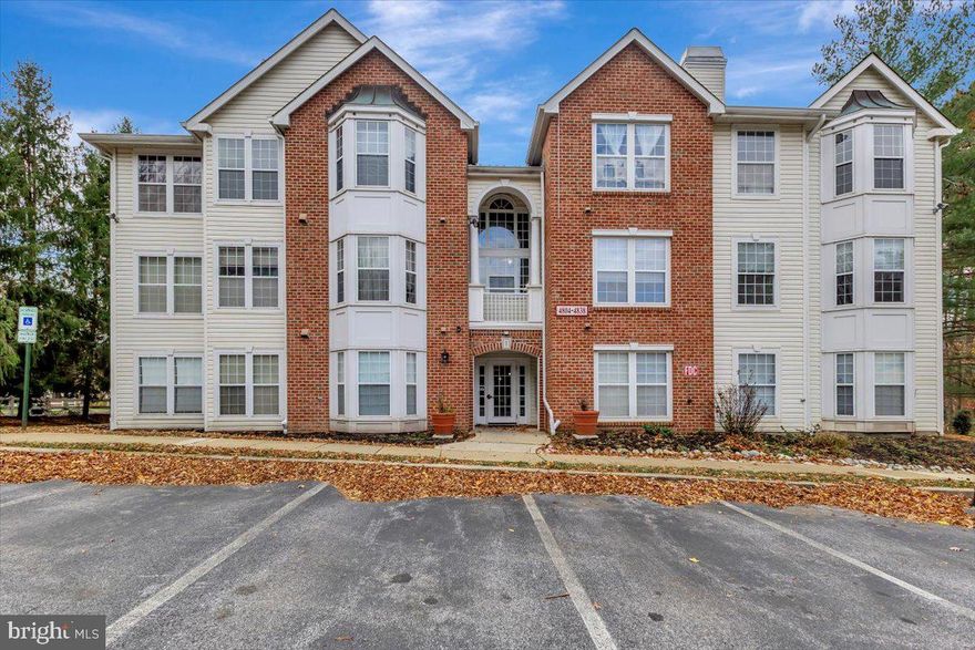 Welcome to this beautiful condo in Owings Mills, a spacious 3-bedroom 2-bath second-floor home offering approximately 1,316 sq. ft., making it one of the largest units in the building. Large windows fill the interior with natural light and the space has been updated with fresh paint, brand-new carpet, and a new HVAC system installed in 2025. The eat-in kitchen features granite countertops and the living room includes a cozy gas fireplace and access to a private balcony that backs to mature trees, creating a peaceful outdoor escape. The primary bedroom is generously sized with its own private bath and a separate laundry room adds everyday convenience. The building’s interior common areas were recently renovated and the community provides ample parking, strong lighting, key-limited entrance doors, and a convenient buzz-in system that rings directly to your cell phone. The seller is also including a one-year home warranty for the buyer, adding valuable peace of mind. The monthly condo fee covers water/sewer, trash, snow removal, lawn care, and common area maintenance. This condo is part of the New Town community, which includes multiple pools, a community center, dog run, tennis courts, walking paths, garden beds, and more. The location is truly exceptional with an easy walk to shopping, restaurants, and daycare, plus quick commuter access to 795, making daily travel fast and convenient. This home combines comfort, convenience, and style in a truly move-in-ready setting.