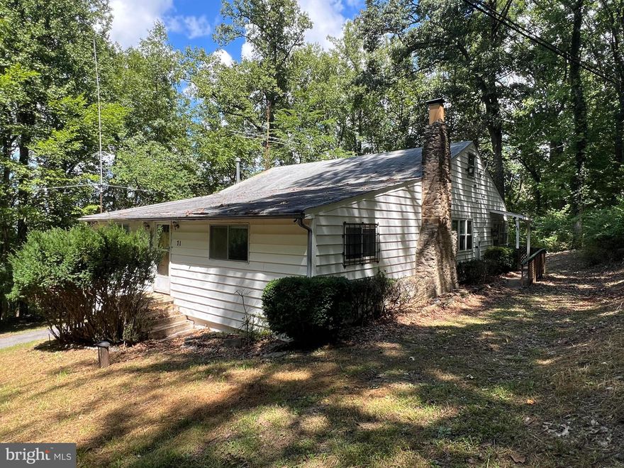 Welcome to a unique investment opportunity in the serene Shannondale community of Harpers Ferry. This property, nestled in the woods on a generous .87 acres spread across three lots offers privacy with huge potential. The home features 4 bedrooms, a full bath, and a half bath, providing a solid foundation for your renovation vision.

With its open and spacious living area and cozy wood fireplace, this home promises a warm and inviting atmosphere once restored. The property also boasts a brand-new well pump, ensuring a reliable water source as you bring your plans to life. Adding to its charm is an old colonial stone fence that offers a touch of historical character.

Though the home is in need of some work, its location is a commuter’s dream, with convenient access to Rt 9 and Rt 340. This is a perfect opportunity for an investor or DIY enthusiast looking to create a dream retreat or rental property in a tranquil woodland setting.

Enjoy the Mountain Lake Club just down the road. This hidden gem of West Virginia’s Eastern Panhandle offers the beautiful 55-acre Lake Shannondale, 25-acre shoreline for year round enjoyment, and the historic ruins left from the fire of the former Shannondale Lodge.  All this and the view of the Blue Ridge Mountains in the distance make this the perfect place to enjoy the outdoors.

Don’t miss your chance to turn this house into a charming home!