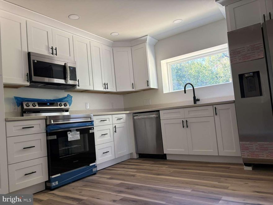 Welcome to your dream home! This beautifully updated 3-bedroom, 2-bath single-family home offers 1,806 sq. ft. of living space on a generous 0.66-acre lot—perfect for anyone looking for comfort, style, and value. Completely Renovated Inside & Out • Brand new roof, new gutters, siding, insulation, and HVAC • New energy-efficient double-paned windows • Entire home freshly painted with luxury waterproof LVP flooring throughout • All new bathrooms with modern finishes • Brand new kitchen with modern appliances, upgraded cabinets, and stylish countertops • Elegant upgraded front door with stained glass & video doorbell with remote view 🌞 Energy Savings That Pay for Themselves • Tesla solar panels to lower your electric bills while helping the environment 🏡 Extra Space & Endless Potential • Full walkout basement ready to be finished – create a second apartment, home office, gym, or family rec room ✨ Other Upgrades You’ll Love: • High-speed internet connectivity • New interior & exterior doors • Brand new mailbox 🚤 Location Highlights • No HOA fees • Quiet neighborhood • Short walk to the beautiful Chesapeake Bay This home is truly move-in ready with every major system and upgrade already completed. All that’s left is for you to enjoy! Don’t miss this opportunity—homes like this go fast!