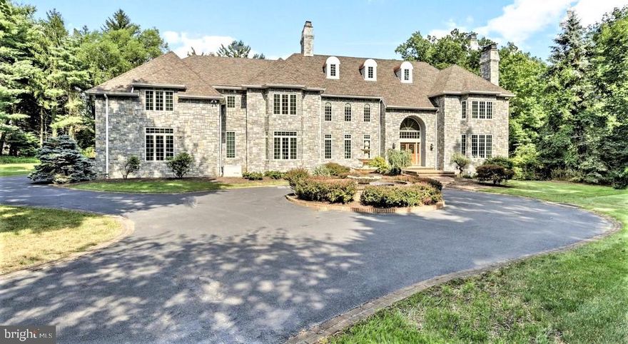 EXCEPTIONAL NORTHSIDE BRYN MAWR LOCATION - down a private road to an impressive Circular Drive, a Water Fountain feature with Double Brick inlay masonry and a WOW fabulous curb appeal presence!! sited on 1.47 serene acres. Modern Stone Mansion has 5/7 Bedrooms, 7.5 Baths, 4 Fireplaces, 4-Car Garage, 3 Finished Levels, Palladian Windows, French Doors, and Walls of Windows showcase this light-filled 10,000+/- Sqft Open Floor Plan of indoor and outdoor living and entertaining spaces.
 
Double Front Doors welcome to dramatic 2-Story Foyer with grand Curved Staircase, floor-to-ceiling Palladian windows and Glass French Doors stream natural light onto the Marble Foyer. Fluted Columns grace the open Living Room with Gas Fireplace, tall windows accentuate the architectural moldings, gleaming hardwood floors and Wet Bar is perfect for entertaining. The Library/Office can also be a 1st floor Bedroom Suite with Full Bath and French doors leading out to Deck.

The 20ft extravagant floor-to-ceiling Marble Fireplace is the focal point in the Family Room and Vaulted enclosed Gazebo that opens out to the rear Deck that spans the back of the home. Elegant Dining Room with exquisite millwork adjoins the large upgraded Chef’s Kitchen with Gas Range, Side-by-side Subzero, NEW Soft-close White Cabinetry with modern Ebony hardware contrasts with Charcoal countertops, Center Island, built-in Desk and flows to spacious Breakfast Room which opens out to rear Deck. Large Walk-in Pantry, Mudroom, double Coat Closets, Powder Room, Back Staircase and entry to attached 4-Car Garage completes the 1st floor of this well designed modern home. Double Doors open to the Primary Suite in the West Wing with Tray Ceilings, sprawling Sitting Room with Gas Fireplace, His & Hers Custom Closets, His & Hers Vanities, Soaking Tub, newly renovated Walk-in Shower, separate Bidet and Water Closet. The East Wing has an UPSTAIRS FAMILY ROOM with Fireplace that serves the 4-Bedroom en Suites with large Closets and lots of windows that stream in natural light, an Upstairs Laundry with White Cabinetry, separate sink, Walk-up Staircase to huge Floored Attic and Back Staircase down to Mudroom completes the 2nd floor. Lower Level 3,000 Sqft has High Ceilings, Open spaces with wall to wall double sets of glass doors to walk out to back lawns, is finished with a Media Room, vast Game Room, large built-in Wet Bar for entertaining, Full Bath for another Bedroom or Fitness Center. 2019 RENOVATIONS included REPLACEMENT ROOF/GUTTERS, STUCCO REMOVAL, NEW EXTERIOR STONE, SIDING, AND WINDOWS. Natural Gas utilities, Public Water and Sewer, Backup Generator,  3-zone HVAC system (2022), upgraded Home Stereo Sound System and Brand NEW State of the Art Security System (2023), Extensive Exterior Lighting, Freshly Painted interior located on very private road in Northside Bryn Mawr; just minutes from the Philadelphia Country Club, Merion Cricket Club, Haverford, Shipley, Baldwin Private Schools and the Award Winning Lower Merion Schools, Parks, Walking Trails, Public Library, Restaurants, and minutes to Septa Trains, Shops at King of Prussia Mall and Center City.