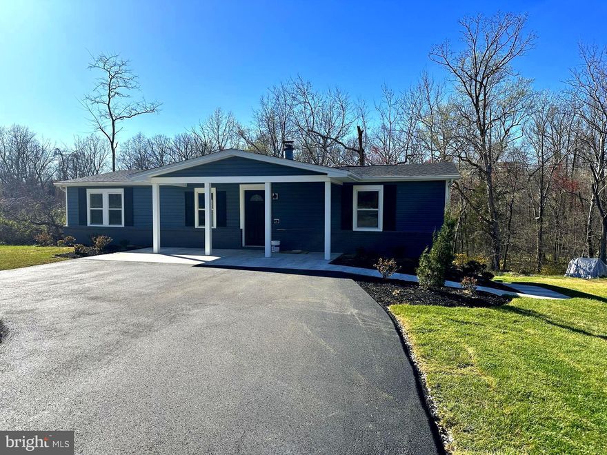 This unique home is all ready to go...This beautiful home offers something a bit more special than all the other ones out there!  The upstairs (main level) has three good size bedrooms, two full bathrooms, an upgraded kitchen with granite, a dining room with access to a beautiful new deck, and a living room with a wood-burning fireplace.   The lower level is accessed only from the outside. It offers a beautiful in-law suite for the extended family. It features two bedrooms, one full bathroom,  an open kitchen with granite counters, a  separate laundry area, and a nice open living and dining combo area.  So nice!  Completely renovated and move-in ready!  Make your appointment today!  This beauty will not last long!