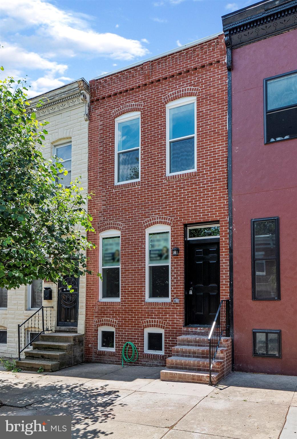 NEW NEW NEW! Completely renovated Townhouse in hot, hot Hampden!!!! Roof and all plumbing, HVAC and utilities are NEW! Open floor plan on main level with gleaming hardwood floors and recessed lighting throughout. Kitchen boasts gorgeous granite counter-tops and stainless steel appliances. 2 Bedrooms upstairs with vaulted ceilings in Master and large walk-in closet. 2 Full Bathrooms and partially finished basement. New Roof. PARKING in rear in fenced/gated yard.