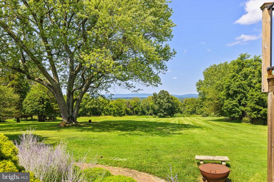 SUBSTANTIAL PRICE ADJUSTMENT
Isaac Eaton House: A Harmonious Blend of History and Modern Living

Nestled in the serene countryside of Leesburg, Virginia, the Isaac Eaton House stands as a testament to early 19th-century craftsmanship and design. Constructed in 1822, this historic residence was built by the original founder of the Village of Mount Gilead using bricks fired in a kiln located directly on the property and enjoys a deep-rooted connection to the local history. The main house features three/four bedrooms, each adorned with original hardwood floors, antique hardware, and detailed millwork and 3 stone fireplaces.  The main home and studio have been lovingly maintained with extensive recent upgrades such has the bathroom renovations, new HVAC systems, interior and exterior painting and water systems.
In 1982, a thoughtful expansion introduced a spacious kitchen and a generous primary suite, seamlessly blending modern comforts with the home's historic essence. The property offers expansive western views, providing breathtaking vistas of the Blue Ridge Mountains and remarkable sunsets from the rear porches.  
Additionally, the property includes a detached two-car garage and a delightful studio equipped with a full kitchen and bath and deck. This versatile space is perfect for guests, a home office, or a creative retreat. The entire 14-acre property is safeguarded by a conservation easement, ensuring its natural beauty and tranquility remain unspoiled for generations to come. Most of the land is open and the gentle slope enjoys the views across the valley. 
Located in a coveted and peaceful area, the Isaac Eaton House offers a rare opportunity to own a piece of history while enjoying the conveniences of modern living.

Property is enrolled in the Loudoun County Agricultural and Forestry District