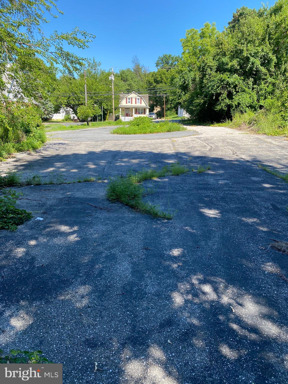 1 of 2 parcels sold together. Both parcels combined total .25+ acre. Large front lot zoned DR16 and back lot is DR5.5. Garage currently on property. A variety of possibilities for residential use. Water, sewer and electric present. Sold strictly as-is. See listing MLS MDBC501416. Both lots sold together for a total of $110,000.