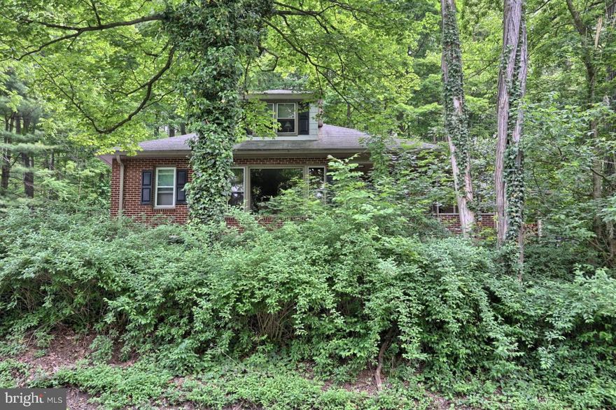 Nestled in a wooded .69 acre lot is this all well maintained all brick home. If you are looking for privacy, this home has a really nice 26x16 covered patio surrounded by a beautiful wooded area. The second floor of this home is a complete primary suite w/luxury bath and walk in closet.  All appliances remaining  in the home convey including dehumidifier.  The main level you will find the kitchen, the family/dining area, 2 bedrooms as well as a full bath. You will notice hardwood floors and newly installed carpet in the home, as well as freshly painted walls throughout. Efficient propane heat, and the tank was recently filled!  If you enjoy the smell of a wood burning stove, this home has one!  Enjoy this beautiful property in the lush wooded hills of Lebanon PA.