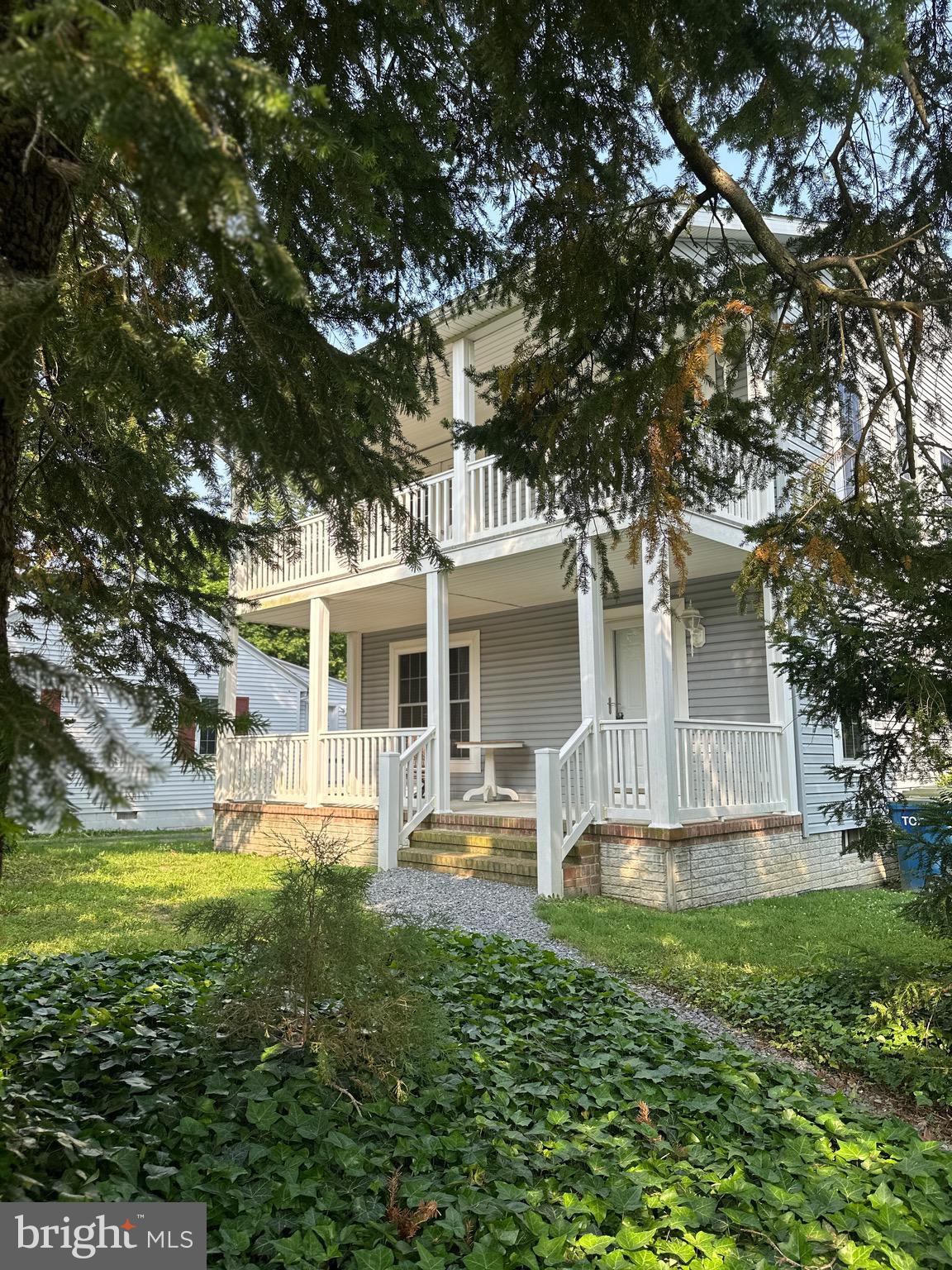 Welcome to 328 North Washington St. This Gem of a house is tucked away behind a screen of mature evergreen and magnolia but walking distance to all the fantastic downtown amenities! The homeowner planned every detail of this home including and amazing amount of windows. Gleaming hardwood floors throughout all living areas. The privacy afforded by the trees are boosted by TWO front poches one downstairs and one shared upstairs by two bedrooms., Plus a rear deck for entertaining. The kitchen is huge with granite counters and a pantry. This house is efficent and has city gas heat. Unlike any other houses in this price range, there is a full basement (exterior access only) for hobbies, music or great storage.