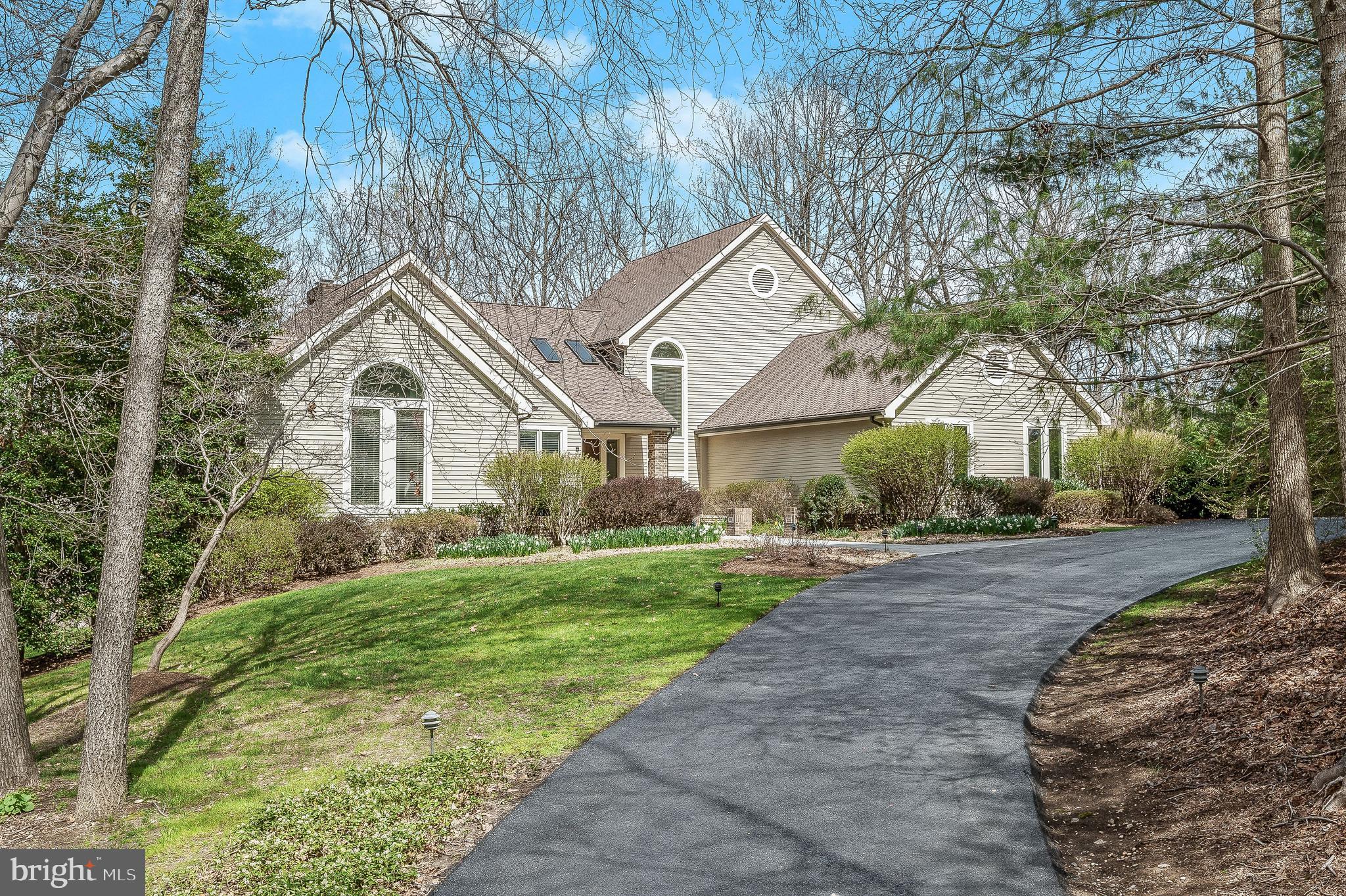 Enjoy resort like living at home in this impressive and stately custom 6BR 6.5BA home sited on a private 5.1 acre wooded lot backing to the Middle Patuxent River. Approximately 10K square feet on 3 finished levels designed for family relaxation and entertaining. Exceptional heated salt water pool with extensive bluestone patio surround, cabana, outdoor powder room, lighted Tennis, Pickle ball, and a Basketball Court! Stunning custom two tone cabinetry chefs kitchen with large center island featuring Subzero refrigerator, two under mounted sinks, two panel front dishwashers, 2 Wolf convection ovens, Wolf 36” cooktop with downdraft, 2 panel front refrigerator drawers, 2 panel front freezer drawers, panel front ice maker, wine frig and an array of well-designed cabinetry offering extensive storage. Amazing great room embellished with a stacked stone fireplace and an inviting bar area, perfect for after dinner spirits. Custom laundry/pantry with 2nd subzero refrigerator, extensive decking overlooking professionally landscaped grounds with flowering trees and shrubs as well as seasonal river views. Main level primary retreat boasts oversized windows, vaulted ceiling, luxury spa bath with separate vanities, separate shower, whirlpool tub, sauna and an oversized walk in closet with built-ins and organizers. High ceilings throughout the home stacked stone features, 3 fireplaces, and oversized rooms designed for entertaining. Finished lower level offers a complete In-law suite adorned with a second full kitchen, recreation room with a fireplace, game room, fifth and sixth bedroom, two full baths, exercise room, 2nd laundry room, hobby room, bonus room, and walkout access to an outdoor paradise. This magnificent home has everything and so much more!
