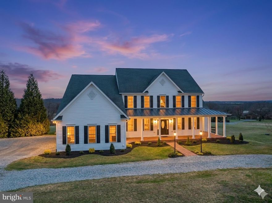 Tucked into the rolling countryside of Bluemont,VA, just minutes from Purcellville, this exceptional fully custom home built by Graystone Homes offers a rare blend of craftsmanship, privacy, and breathtaking natural beauty. Thoughtfully sited on 10.7 acres to capture spectacular 360-degree mountain and pastoral views, the home was designed to maximize light, space, and the surrounding landscape while providing complete privacy to the rear of the property. All with no HOA!
Inside, the home showcases refined architectural detailing and high-end finishes throughout, including hand-stained red oak hardwood floors, soaring 11-foot ceilings, extensive crown molding, wainscoting, transom windows, and beautifully designed living spaces that flow effortlessly for both everyday living and entertaining.
The professionally designed kitchen is the centerpiece of the home, offering custom cherry cabinetry, personally selected "Rainbow" Granite Counters, abundant prep space, a large island, walk-in pantry,  Bosch appliances sub zero refrigerator drawers, and GE Trivection ovens. An open-concept layout connects the kitchen to the breakfast nook and family room, creating a warm and inviting gathering space highlighted by one of the home’s three gas fireplaces.
Designed with flexibility in mind, the home features 2 primary bedroom suites, one on the main level with a sitting room and gas fireplace and one on the upper level -both with walk-in closets and en-suite baths. A quiet home office with custom built-in cabinets and accent lighting. A music room, just off the foyer is accented with a chandelier and crown moulding.  A full laundry room on both the main and upper level, and beautifully scaled rooms ideal for modern living.
The lower level offers exceptional recreation and entertainment spaces including a billiards room, bar area, game room with fireplace, and a custom theater featuring a Sony HD projector, Dolby surround sound, tiered seating and light up candy bar. There is a 5th bedroom or gym on the lower level and a wall of windows brings in lots of natural light and offers direct walk out access to the fenced back yard. A new deck ( 2025) to enjoy star gazing. Enjoy summer evenings relaxing in the screened in porch. 
Beyond the main home, a separate oversized garage has 3½ bays with Epoxy Flooring, extra height for RVs, boats, or vehicle lifts and a second-story unfinished space designed for a future apartment or studio. 

The property is equally impressive outside, offering ample space for gardens, vineyards, horses, or recreational amenities such as a pool, tennis court, or sport court, all set against the dramatic views of the Blue Ridge.

Modern comfort is ensured with extensive whole-house smart systems, including Sonos digital audio, whole-house water softening, electronic air cleaning, humidification, structured wiring for home Ethernet, Guardian security system, and a 20KW automatic Siemens Generator, along with three-zone high-efficiency HVAC, Andersen Windows, 600 AMP electric service and On -Demand hot water heater, and (2) 1000 gallon in ground propane tanks. High Speed Internet by All Points 5G.  Convenient location in walking distance to Bluemont Montessori School, Bluemont Community Center-child care and classes/ activities, and Bluemont Country Store. Outdoor enthusiasts will enjoy a hike at nearby Bears Den or the Appalachian Trail or paddle the Shenandoah River. Minutes to Purcellville Grocers, Franklin Park Pool and Theatre. Despite its peaceful setting, the property offers convenient access to Route 7 and is within easy reach of Leesburg, Dulles Airport-30 min, and Washington, D.C., providing the perfect balance between countryside serenity and everyday accessibility.
A rare opportunity to own a meticulously built custom estate in the heart of Virginia’s wine and hunt country, where sweeping views, thoughtful design, and exceptional quality come together to create an extraordinary place to call home.