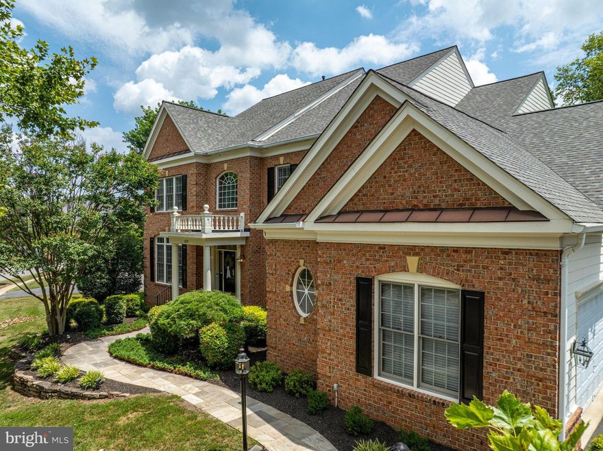 Open house CANCELLED. Welcome to your dream home in Leesburg, VA — a stunning, sun-filled single-family residence nestled on over half an acre of serene, private land in the prestigious Lansdowne on the Potomac community. With 5 spacious bedrooms, each featuring its own ensuite bath and walk-in closet, and 4.5 bathrooms in total, this residence is thoughtfully designed for both everyday living and elegant entertaining. Step into a sun-filled open floor plan where expansive living spaces flow effortlessly from room to room. The heart of the home is a sun-drenched gourmet kitchen, featuring an oversized island, custom cabinetry, stainless steel appliances, and a large window that brings the outdoors in. Adjacent, you’ll find a cozy breakfast room, butler’s pantry, and dry bar, perfect for setting up your morning coffee station or evening cocktail hour. The open layout continues into the family room with a striking coffered ceiling and gas fireplace, while a formal dining room, living room, sunroom, and home office provide flexible spaces to fit every lifestyle. Beautiful hardwood floors span the majority of the home, complemented by plantation shutters throughout for a touch of timeless charm. Upstairs, the primary suite is your personal retreat with a sitting room, gas fireplace, wet bar, dual walk-in closets, and a private veranda. The ensuite bath includes separate vanities, a soaking tub, walk-in shower, and overhead skylight, providing the perfect place to unwind at the end of the day. The finished walkout basement is a home of its own, featuring a second kitchen/bar, in-law suite, fitness room, game room, full-size windows, and generous storage. With a private exterior entrance and interior staircase, it offers ideal flexibility for guests or multi-generational living. Outdoor living is a true highlight, featuring a deck off the main level for lounging or dining, a veranda off the primary suite for private morning coffee or evening relaxation, and a spacious lower-level patio with extensive hardscaping. The patio includes a hot tub, built-in grill and burners, an ideal setup for outdoor entertaining in style and comfort. The 3-car garage offers ample space for vehicles, storage, and hobbies. Located in the amenity-rich Lansdowne on the Potomac, residents enjoy indoor and outdoor pools, a newly renovated fitness center, clubhouse, trails, playgrounds, tennis and pickleball courts, and more. Just minutes from Lansdowne Town Center, One Loudoun, and Historic Downtown Leesburg, with easy access to Route 7, this home offers the perfect blend of privacy, luxury, and convenience. Don't miss this extraordinary opportunity in one of Loudoun County's most desirable communities!