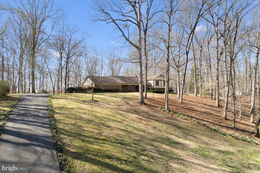 Gorgeous 5.65 acre  private lot in gorgeous Cedarwood in Dunkirk! The huge 4 level split sits majestically on it's lot that backs to trees and even has a stream for exploring.  So many upgrades have been recently made in the last 3 years!  Roof, paved driveway, new flooring, heat  pump, Quartzite counter tops, beverage refrigerator, painting throughout, upgraded all the bathrooms and appliances in the kitchen.  Just imagine 3056 sq ft above grade and an additional 1160 sq ft unfinished lower level  for storage, game room, or whatever you want with a walk out to the back yard.  The beauty of a 4 level split floor plan is there is a level for everyone!  No more wishing you had some privacy but cant find it when everyone is home! Main level features a huge recreation room as well as a living room and open dining room space.  The kitchen features loads of cabinetry with new Quartzite countertops and stainless appliances.  Upper level has 3 spacious bedrooms and the third level has yet another recreation room, guest bedroom, full bath and office.  The forth level is unfinished but has 9' ceilings and lots of windows for future finished space or loads of room for storage.  This is truly a custom estate home that is all brick and sits impressively on it's almost 6 acre lot.  A wonderful place to call home!  Blue Ribbon schools and less than a mile away commuter access bus lot in Dunkirk. Owners would like to stay until  June 15th if possible. ASSUMABLE VA LOAN!  2.625% with $555,000 remaining!