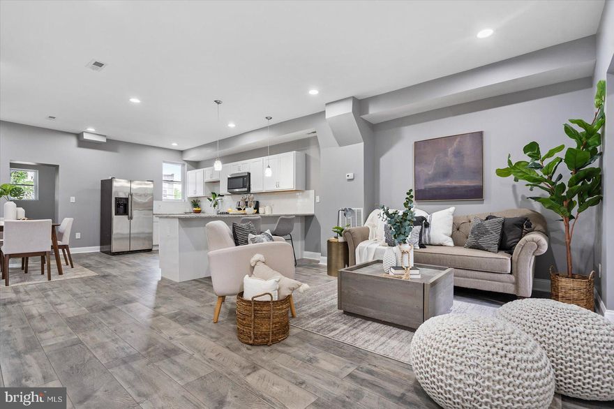 LIVE IN LUXURY! This designer home has it all as the builder left no stoned unturned this a BRAND NEW RENOVATION! Walk into this gorgeous 4 Bedroom 3 Bathroom open layout with a rear deck in the back! Enjoy the designer finishes, modern floors and many windows flooding the home with natural light. The kitchen features stainless steel appliances, granite counter tops, designer finishes and an abundance of counter top space and cabinetry. There are 4 bedrooms with no shortage of closet space! The home also features an awesome walk out deck in the rear of the home plus a fully fenced in yard! Our team specializes in working with home buyers and we are happy to help you get set up with a mortgage and will ensure you take advantage of all the home buyer programs! This home is perfect for the Maryland Mortgage Program, LIVE Baltimore programs and many others! Set up your tour today!