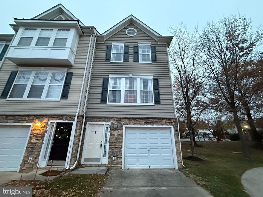 Welcome to 23004 Fontwell Square, an exceptional end-unit townhome-style condominium offering outstanding value and space in the sought-after Parkside at Dulles community of Sterling, VA. This residence provides three bedrooms and three full bathrooms across 1,478 estimated finished square feet. It offers a practical layout highlighted by an abundance of windows that maximize natural light, and includes an extremely convenient entry-level bedroom and a full bath. The property features an open floor plan with hardwood and carpeted areas, vaulted ceilings, and a combination kitchen/dining space with a kitchen island. The home is equipped with essential appliances, including a built-in microwave, built-in range, dishwasher, disposal, dryer, refrigerator, washer, and water heater. Parking is provided via an attached garage with additional storage. This property is an excellent opportunity to gain access to the outstanding community amenities, which include a Club House, Exercise Room, and Outdoor Pool. The location is unbeatable, offering convenient access to shopping, dining, major commuting routes, and exceptionally easy access to Dulles International Airport. Lawn maintenance and snow removal are included in the condominium fee. All applications for this rental are handled efficiently via RentSpree.