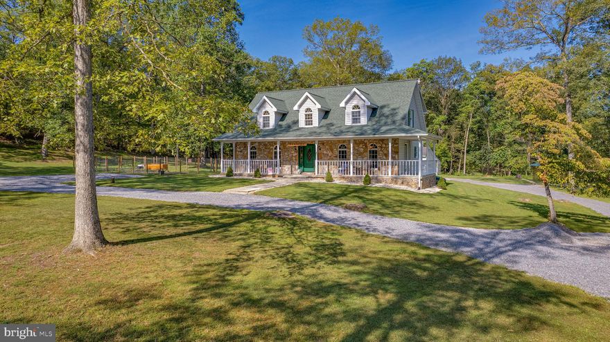 Looking for serenity? Look no further. This BEAUTIFUL 4 bedroom, 2 1/2 bath house settled on 1.43 acres of pristine land is available for purchase. Unrestricted! Just minutes from town and easy access from Rte 9 West. The house is roughly 2,700 sq ft. and an entertainer's dream. It provides a huge country kitchen that has a sprawling island with room for seating. Lots of counter and cabinet space, hardwood flooring, and a formal dining room. The upstairs has a spacious primary bedroom with his and hers walk-in closets and a large sitting room. 
Enjoy the outdoors with this beautifully maintained 1.5 acre lot that features a luscious yard, two fenced off areas they use for a garden and the other for their pets, and lots of areas for your summer picnics and level areas to set up a trampoline, badminton set, volleyball, whatever you can dream up. The house has a large wrap-around porch and there is a cement deck off of the kitchen where you can set up your grill, smoker, picnic table and more. 
A large circular driveway with ample parking is provided and the driveway continues to the back of the house where there are two outbuildings (with electric) and a new carport.
Best of all? Privacy! Set off from the road the house sits beyond a large circular lawn (birdbath included) and as you enjoy your coffee while sitting on your porch you will be able to listen to the trees, the birds, the crickets, watch the rain from the porch without seeing many cars drive by. Winter? Enjoy your coffee by the new wood stove (the owners added that they sat on that porch throughout the winter, as well). Priced to sell, now is your time to grab this great opportunity.