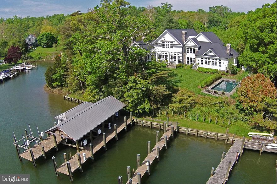 Private tree lined driveway,canopied with silver maples, leads to this exceptional Waterfront Manor Home built in 2002 with fine materials &  detailing on 7.9 acres.  Elegant & welcoming interior w/ 5 en suite BRs. Protected deepwater piers w/ boathouse & 3 slips on Little Aberdeen Creek. Waterside pool, ample acreage for horses & a 3 stall barn overlooking fenced pastures.