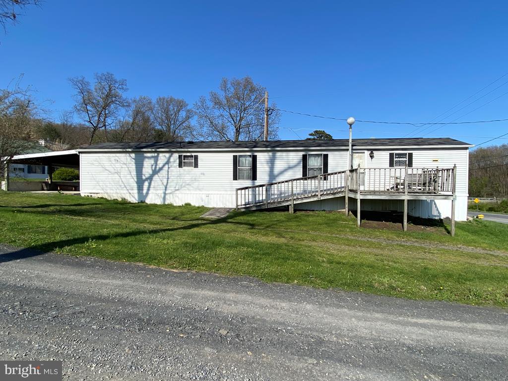 Single-wide trailer with a carport and deck. There are 2 adjoining parcels, both with double-wide trailers, that could be purchased as a package. Call the listing agent for more details or to schedule a tour.