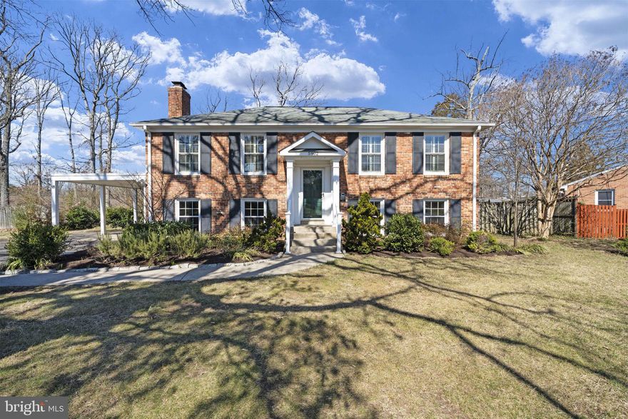 **OFFER DEADLINE: SELLER REQUESTS HIGHEST & BEST OFFER BY MONDAY AT 12 NOON**  This charming brick home sited on a large .28 acre lot, offers stately curb appeal in a popular neighborhood. The main level features an open-concept dining and living area, highlighted by elegant crown molding and plantation shutters. Hardwood floors throughout most of the main level enhance the home's warmth and character. The well-appointed kitchen boasts beautiful wood cabinets, a subway tile backsplash and a window over the sink, making it both functional and relaxing.  Two spacious bedrooms and a full bathroom complete the main level. The lower level is designed for relaxation and entertainment with a cozy family room featuring a brick fireplace. Two additional bedrooms and another full bathroom provide ample space for family or guests. There is a large storage and laundry area for added convenience. The property includes a large deck, perfect for grilling and entertaining, and a beautifully landscaped backyard.  An attached carport and large driveway provide for easy in and out.