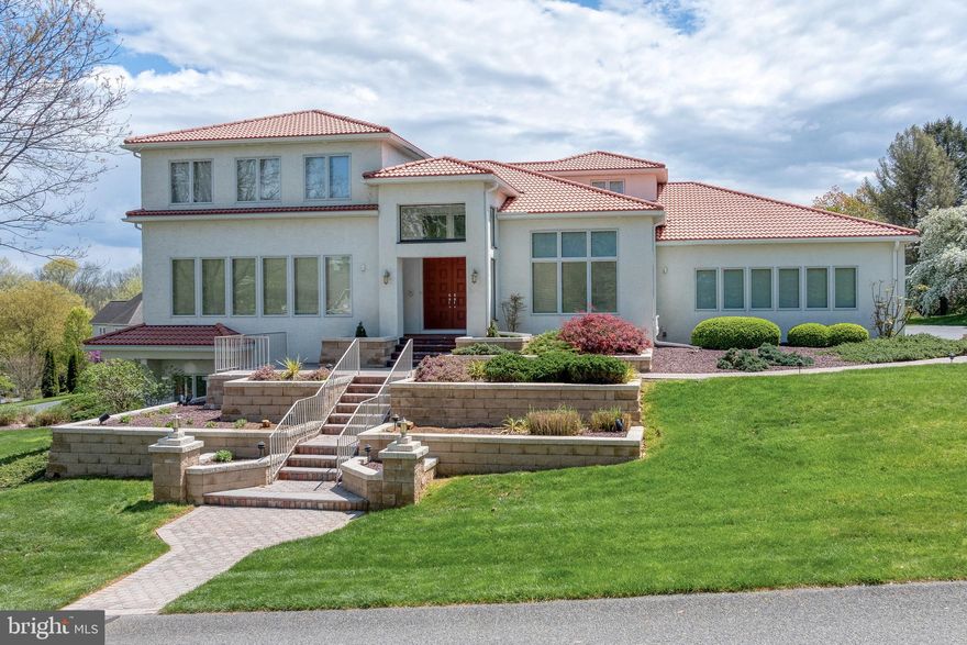 Welcome to your 6,130 square foot contemporary Mediterranean oasis! 🌴
This stunning property combines contemporary architecture with classic Mediterranean style. A terracotta roof and stucco exterior help to create an ambiance of timeless elegance. 🏡
Step through the large double entry doors into a grand foyer with exotic tile flooring, setting the stage for luxury living at its finest. The first floor features a spacious living room with a cozy fireplace, perfect for gatherings and relaxation. The kitchen is a chef's dream with white cabinets, a large island, gas and electric ranges, two refrigerators and granite counters, while the adjacent dining area and family room offer an abundance of space for entertaining.  🍽️
Enjoy an endless stream of natural light flowing in through the many large windows🪟, highlighting the beauty of this unique home's design. Step into the outdoor patio with tile flooring, ideal for al fresco dining or enjoying your morning coffee in the sunshine. ☀️😌
Comfortably work from home in the large office with hardwood flooring, and take care of laundry with ease in the convenient laundry room featuring ceramic tile, a utility sink and storage cabinets. The first floor also offers a half bath for guests' convenience. 
Retreat to the large first floor primary bedroom 🛌 with a tray ceiling and indulge in the luxurious primary bathroom featuring a double vanity and tile shower 🛁. The highlight of this beautiful home is the amazing atrium 🌴with a three-tier fountain, creating a serene indoor atmosphere that feels like an outdoor sanctuary, allowing you to relax and unwind in peace. 
Upstairs you will discover three bedrooms with hardwood flooring and two full bathrooms, offering plenty of space for family and guests. The wide hallway with hardwood flooring provides a stunning view from above the atrium, adding to the home's impressive architecture and charm. 🌺
The spectacular lower level is perfect for entertaining or can serve as a second complete living quarters, with a large recreation room, second kitchen, two additional bedrooms, two full bathrooms, and an exercise room 🏋️‍♂️. Large windows flood the space with light, while an outside entrance provides easy access to the lush outdoor surroundings. 
You will also have access to a separate driveway and attached garage from the lower level, allowing it to function as its own complete living space. With an endless array of luxurious amenities and exquisite design, 23 Deerfield Rd offers the perfect blend of elegance and comfort, so don't miss your chance to make this contemporary Mediterranean paradise your own! 🏠✨