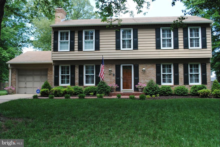 GEORGEOUS!  Perfectly maintained updated home. Special features include 3 finished levels, hdw floors and plantation shutters on main and upper level, newer windows, updated kitchen has granite counters, extra lighting, custom paneled refrigerator and dishwasher, den with fireplace with custom mantel, wet bar and wine cooler,  LL has built-in bookshelves, lots of storage, Professionally landscaped