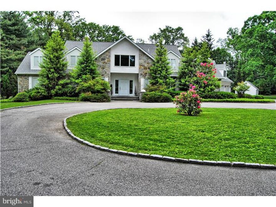 One of a kind property. Home sits on a private 2.5+/- acre lot. It has an attached and heated 3-car garage, natural gas backup generator (in a free-standing shed), a full array of solar panels, a central vacuum system and intercom system and a separate office/guest house complete with kitchen, bath and its own parking lot.             Rebuilt from its foundation 18 years ago, the main home boasts 5,250 sq ft of living space with 4/5 bedrooms, 5 bathrooms and two powder rooms. The first floor master bedroom has separate his and her baths and walk-in closets/dressing rooms. The first floor also has a grand two-story foyer, a study, living and dining room areas, a wet bar, a laundry room, a large walk-in pantry off the kitchen and two powder rooms.             The second floor has two generous size bedrooms sharing a bath, an additional bedroom with a full walk-in closet and master bathroom, a large, walk-in cedar closet and three large linen closets. A huge bonus space above the garage provides excellent storage.             The walk-out basement features a large living space with a fireplace and a tall bank of windows, a handsome bed- or card room, a full bath, a large walk-in closet and a separate outside entrance.             The guest house/office is a free standing 1800 sq. ft. structure ? redesigned ? with two bedrooms or offices, a large living area, a kitchen, a full bath, a powder room, a laundry room, a large second floor loft which looks out over the living space and a full basement. The guest house/office has a complete solar panel system on the roof which back feeds into the power grid, its own HVAC, its own septic system and a large parking lot.             Set back from the two main buildings are an older basketball court, a very large fenced in garden and a garden shed.             Don't miss this one of a kind property ideal for multi-generational families or a professional looking to have their office or practice next to their home. For aerial video of the property go to:  ***. Both virtual tour and aerial tour are available by clicking on the virtual tour link and scrolling down to the bottom of the page.