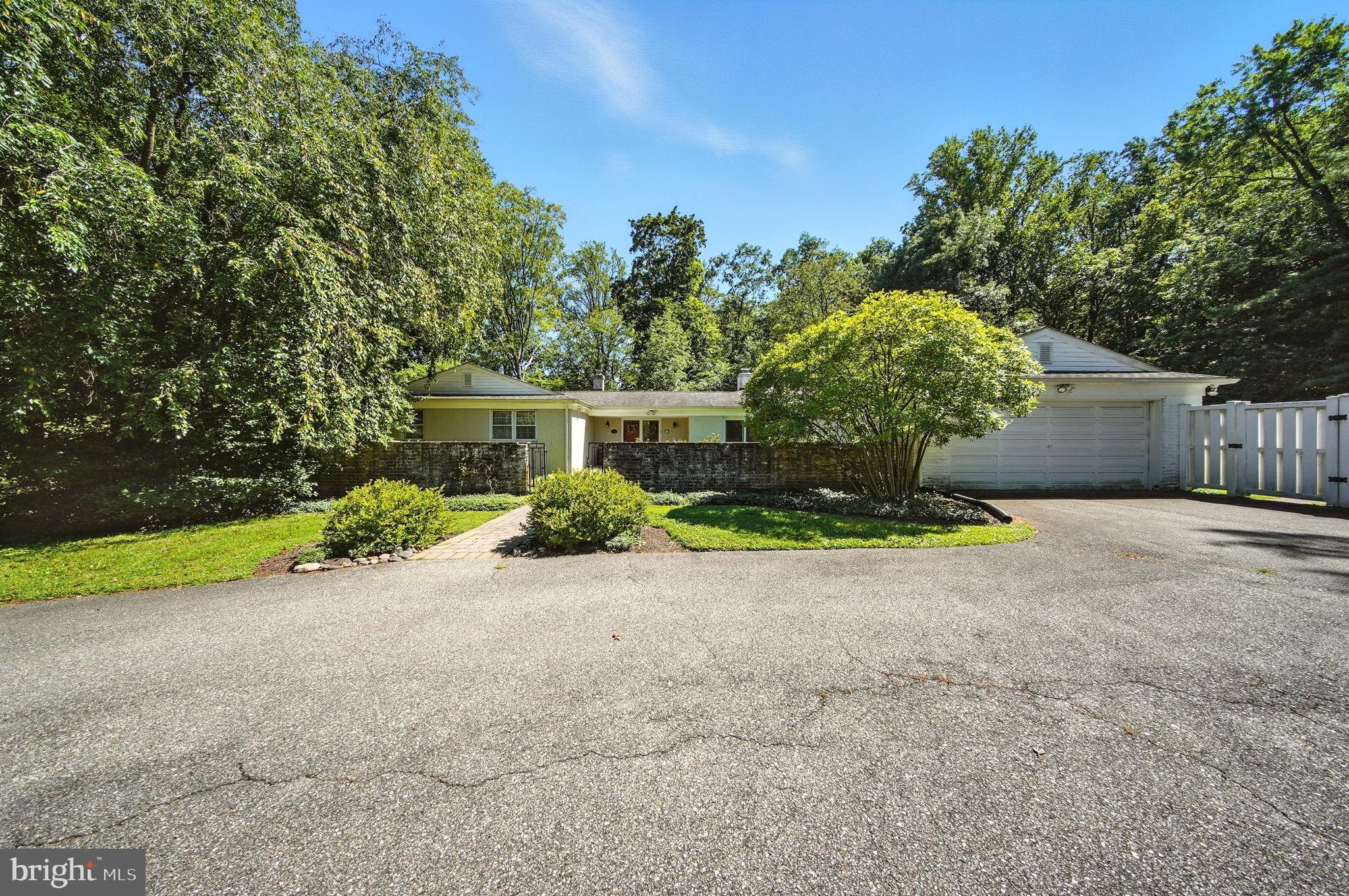 Welcome to your beautiful Oasis in Ambler. Spacious 3-bedroom, 2.5-bath ranch set on 1.34 acres with over 2,000 sq. ft. of living space. Tucked away on a private, tree-lined lot, this home offers a circular driveway, attached two-car garage, and inviting front entry courtyard.
The interior features a bright living room with hardwood floors and large windows, a cozy den, and a built-in wet bar perfect for entertaining. The functional layout includes three well-sized bedrooms, 2 full baths, and a convenient half bath.
Outdoors, enjoy a peaceful setting with a large backyard, mature landscaping, and a private pond. Plenty of space for recreation, gardening, or simply relaxing in nature.
With 2,081 sq. ft. of living space on 1.34 acres, this property combines privacy, comfort, and potential — ready for its next owner to make it their own.