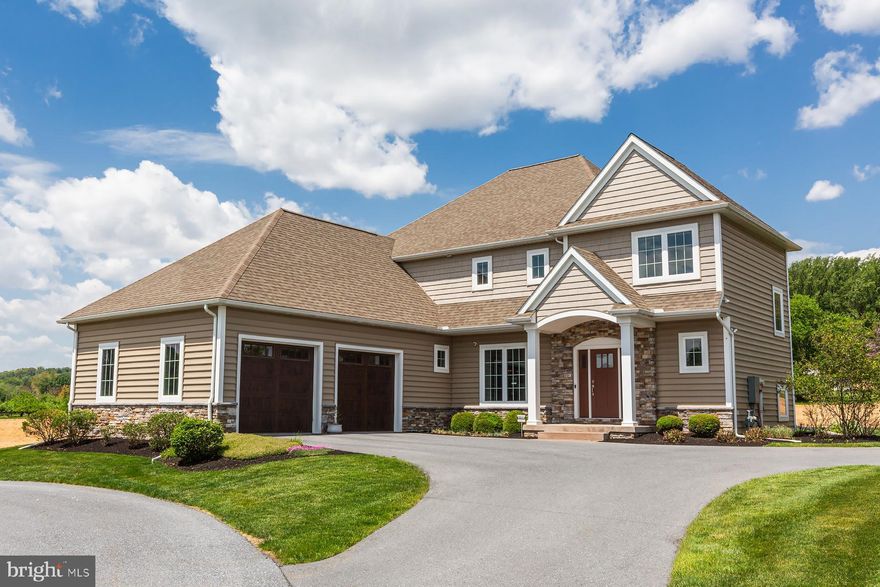 Welcome home to this Magnificent Manheim Township Stunner. Eight years young, it would cost you a substantial amount more to build this home today. Just shy of 4,000 square feet of first and second floor living space with an additional 1334 square feet in the professionally finished lower level. First floor boasts large open spaces flowing one room into the next great for hosting family and friends, huge kitchen island, custom kitchen countertops, refrigerator drawers, built in Miele coffee/espresso maker, large walk-in pantry with built-ins, family room with stone gas fireplace and built-in bookshelves, sunroom with stone gas fireplace, tile floor and tons of natural light, formal open dining room with large windows, crown molding and chair rail,  an office nook, and a drop zone area right inside the garage. Second floor is complete with four bedrooms, three full baths a generous sized laundry room, and a primary suite with two walk-in closets, split vanities, a spa like walk in shower with programmable faucet system, and a soaking tub. Lower level has built in cabinetry with dishwasher, sink, and refrigerator, projector and screen for, TV, movies, and sports, bedroom with full bath and built in Finlandia Sauna. Outdoor living includes a large screened in porch and concrete patio. Garage is oversized and can accommodate three cars. Don't miss your opportunity to own this great home at a substantial savings over new construction. Nothing left to do in this gorgeous home, just move in and enjoy.  Check out the photos floor plans and schedule your tour today.