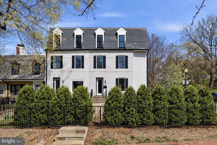 Bathed in natural light from its prized southern exposure, this exceptional end-unit residence stands proudly on a prominent corner lot in one of Burleith’s most desirable locations. Completely rebuilt with uncompromising attention to detail, the home spans four thoughtfully designed levels that merge classic elegance with contemporary comfort. Upon entry, striking herringbone-patterned hardwood floors lead into a gracious open living space. The dining area and gourmet kitchen are enhanced by statement lighting and custom Italian cabinetry, complemented by quartz counters, an oversized island, and a suite of high-end appliances including a wall oven, built-in microwave, and dual wine refrigerators. Glass doors extend the living area to a private deck, ideal for hosting under the stars.

The second floor hosts a refined primary suite with dual closets, balcony access, and a serene spa-like bath, along with two additional bedrooms and another full laundry. This level provides a private retreat, designed for both relaxation and entertaining, with a terrace, dual dressing rooms, an office nook, and a luxurious bath wrapped in designer tile with heated floors and a walk-in shower.

The lower level is equally impressive, with its own entrance, a spacious family room, a full bath, a large bedroom, a secondary laundry, and a kitchenette with a full-size refrigerator—perfect for extended guests or flexible living.

The exterior is framed by professionally lit landscaping, a fully fenced yard, and secure two-car parking with a roll-up door. Tucked just north of Georgetown, Burleith is a serene, tree-lined enclave known for its charming brick rowhomes, strong sense of community, and enviable proximity to the city’s best amenities. Residents enjoy strolling to Georgetown’s vibrant dining, boutique shopping, and waterfront, while nearby parks and gardens offer peaceful escapes. With its quiet residential streets, walkable location, and easy access to major thoroughfares, Burleith delivers a rare balance of neighborhood charm and urban convenience.