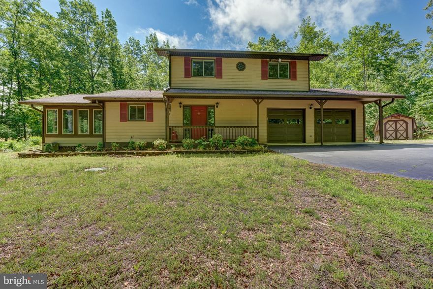 Don't miss this incredible opportunity to own in Windwood Coves at Lake Anna, situated within a gated community with High Speed Fiber Internet! This charming lake-access retreat includes your very own assigned boat slip (#30) in the main common area and is located in the most coveted subdivision at Lake Anna.  With 1,568 square feet, 3 bedrooms, and 2.5 baths, this home is full of potential and just waiting for your personal touch!  You'll also enjoy peace of mind with a whole-house Generac generator (2021), and a handicap-accessible motorized stair lift.  The main level offers LVP flooring in the kitchen, a cozy gas fireplace in the family room, and a half bath.  Step into the sunroom that was beautifully redone in 2016 and features wood ceilings, roll-out windows, and a built-in bench: the perfect space for your morning coffee or a peaceful afternoon read.  Upstairs, the primary suite has a walk-in closet and private full bath, while two additional bedrooms (each with their own walk-in closet) and another full bath provide plenty of space for family and guests.  Outside, enjoy relaxing on the covered front porch, entertaining on the back deck, or gardening in the raised garden beds.  A two-car attached garage, paved driveway, and electric-equipped shed provide great storage for all your lake gear and tools.  Beyond its natural beauty, the community offers a range of amenities to enhance your lifestyle, including spending your days boating, fishing, or simply soaking up the sun on the shores of the lake.  Nestled in the sought after Windwood Coves Subdivision, a gated community on the lake.  Great mid-lake location just minutes to groceries, dining, Lake Anna Taphouse and more!  Explore hours of fun at the common area where you can launch your boat and enjoy the large sandy beach, picnic pavilion, playground, pickleball and tennis court.  Golf Cart friendly community!  Come see for yourself and start making your memories here with your family and friends! HVAC 2015 | Generator 2021 | Septic pumped 2022