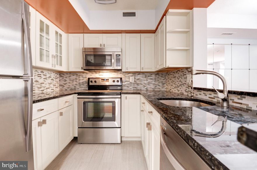 A Lovely 1 bedroom + den  in renowned Charleston Condominium at Clarendon-Courthouse! Featuring an open floorplan, renovated kitchen with stainless appliances, ornate backsplash, exotic granite counters    Freshly painted   Enjoy the large primary bedroom which includes a full walk in closet and beautiful private southern views. Extra guest bedroom or office, den, with French doors. Wide plank Brazilian cherry laminate flooring.  The beautiful sunroom with sliding glass door for privacy is perfect for relaxing after a long day or can be used as a office or extra room! Garage  parking space #63 is conveniently located , near the entrance for easy access. This unit comes with it's own private storage bin, parking space located on P2 (storage room door #19 access on P1). Utilities are included in the condo fee except electric. A set electric fee is $45.83 a month fixed. Amazing building amenities, fitness room, pool . Bike stations, social resources,   Walk to Courthouse Metro rail (1 block), Clarendon Metro (8 min walk), Whole Foods, TraderJoes, AMC Theater, Barnes & Noble, Soul Cycle, Apple Store, Pottery Barn, Sephora, Rocky Run Park, Courthouse Farmer's Market, so many restaurants and various boutique shops! Enjoy the incredible Clarendon vibe!