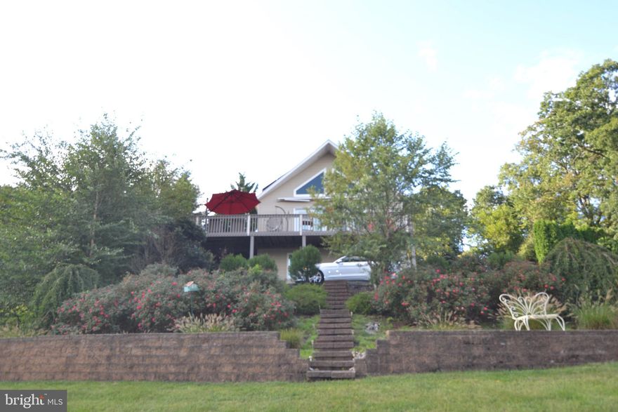 Beautiful chalet style home in a gated community, sit on top of a hill to show gorgeous views.  Open concept house shows off the space and the views.  Enjoy your coffee or your workday on the balcony.  Master suite on top floor and 2 additional bedroom and bath on main level.  Come enjoy the lake community and wild life views.  Solar panels have current 20 year lease and drastically reduce electric bill.