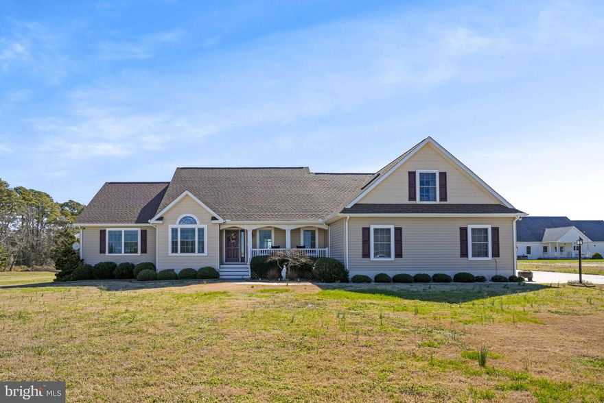 Discover serene living in this beautifully renovated contemporary home, perfectly nestled in a peaceful community with picturesque water views. The home welcomes you with a covered front porch and a gracious foyer, leading into a spacious living room that features a cathedral ceiling and inviting fireplace, exuding warmth and style. This home embraces an open-concept design, seamlessly connecting an office space and a formal dining room adorned with elegant hardwood floors. The modern kitchen is a chef's delight, boasting a breakfast bar, granite countertops, and stainless-steel appliances, including a large commercial refrigerator. Adjacent to the kitchen, a cozy breakfast nook offers casual dining charm. The main level also includes a convenient half bath and a primary suite complete with a large walk-in shower, providing a luxurious retreat. Three additional bedrooms and a full bath accommodate family and guests. A 3-season room with bay views enhances the home's allure. Upstairs, a vast bonus room, with its own private bathroom, offers endless possibilities for entertainment or relaxation. Additional features include a 2-car attached garage, all situated just minutes from Wallops and Chincoteague Island. This extraordinary home combines modern luxury with tranquil surroundings, promising a perfect coastal lifestyle.