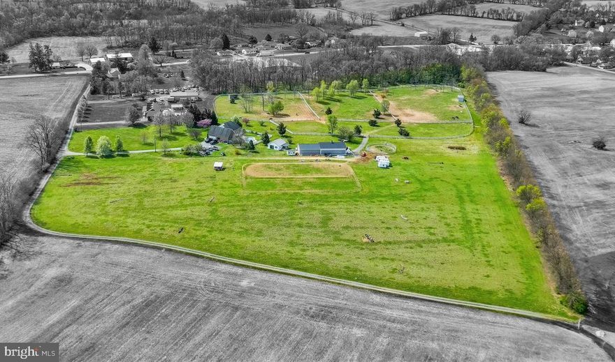 Set on approximately 20 picturesque acres in Silver Spring Township, this thoughtfully designed equine property offers the ideal blend of functionality, comfort, and scenic appeal. A tree-lined gravel drive welcomes you to a beautifully maintained farm centered around an impressive 8-stall barn featuring hot and cold water, automatic waterers, matted stall, and a large combined tack and feed room. The barn is intelligently divided, with a flexible rear section for hay, shavings, and tractor storage that can be opened or closed off from the stalls as needed, plus a convenient washer and dryer hookup to handle the demands of barn life. The land is well laid out for horse ownership, offering four fenced fields—three of which connect to a larger front pasture—enclosed with electric vinyl fencing. Additional features include a designated hay field doubling as a cross-country field, and a currently taped-off area used as a ring. A secondary, smaller pole building has been fully finished with heat and A/C, providing excellent potential for a home office, studio, or additional storage. The ranch-style home, built in 1999, offers an open concept layout with 3 bedrooms and 2.5 baths, with the potential for a 4th bedroom in the partially finished lower level alongside the existing half bath. The owner’s suite features a walk-in closet and private bath, while two additional bedrooms share a hall bath. The mudroom connects directly to the oversized three-car garage and includes laundry as well as a dedicated dog washing station, an ideal setup for both everyday living and farm life. A charming walkway leads to the front porch, perfectly positioned to overlook the expansive front lawn and long driveway, creating a welcoming and picturesque setting. The fenced backyard and pool provide a private space to relax and unwind after a day in the barn. Done miss this amazing property! Professional Photos coming on the 15th.