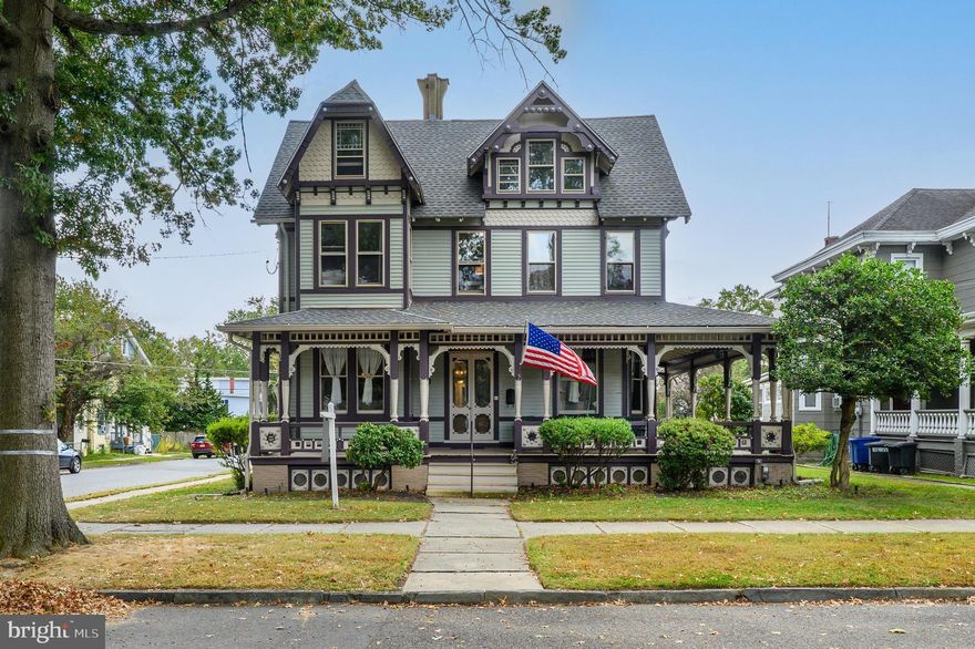 Discover the allure of 48 Broad Street, a stunning Queen Anne Victorian gem built in the 1880’s with artisanal elements you just cannot find in today’s new construction. Set on a prominent corner lot in the heart of Mount Holly's historic district, you are centrally located to schools, places of worship & downtown shops & restaurants to be able to stroll down with family and friends for some fun! Originally a prestigious music and singing school, this home captivates with its inviting wrap-around porch, strong color pop of architectural details & significant size offering 5,000 sq ft. Inside, rich woodwork and a grand staircase with original stain glass moments highlight the home's timeless elegance. Enjoy the warmth of character and history while entertaining with modern amenities. The 2022 kitchen renovation invites the grand entertainer to cook up a storm for their guests with high end Bosch appliances, a wine fridge located within the 11’ granite topped island, and located just off the kitchen in the oversized new laundry room, the sellers are even leaving a large scale freezer! The full bathroom on the second floor was also upgraded in 2022 hosting modern stylish tilework in the walk-in shower and a quartz countertop on the vanity. Other noteworthy recent upgrades are in 2020 the roof was replaced and the basement was waterproofed and with updating the kitchen and full bathroom the electrical panel was also updated in 2022. Offering 7 bedrooms in total between the 2nd and 3rd floors, the layout is ideal for both intimate gatherings and grand entertaining. A celebrated participant in local historic tours, this home is a must-see for those seeking a blend of history and luxury.