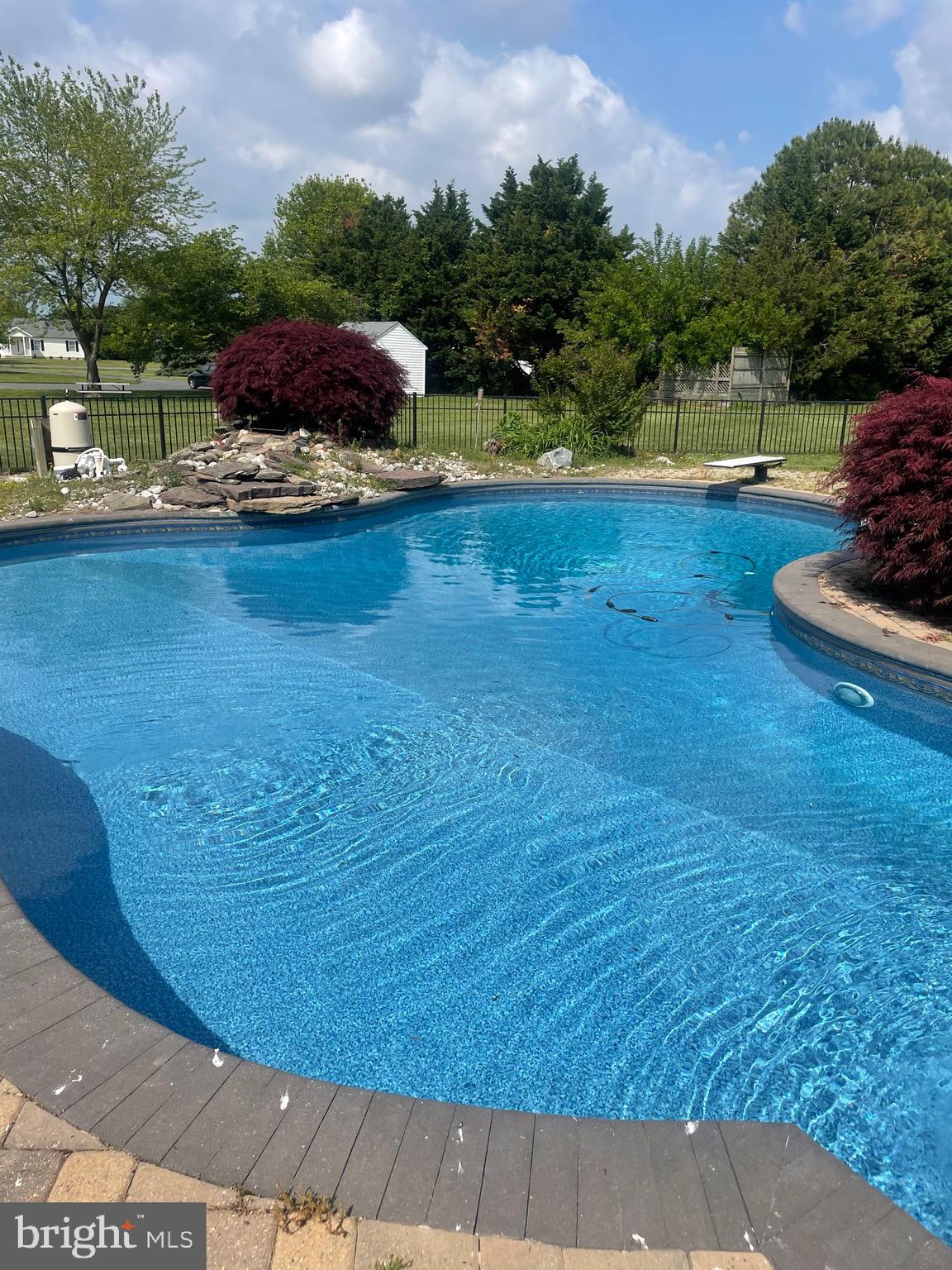 Welcome to 8556 Tuckahoe Road—your private retreat on over an acre just minutes from Tuckahoe State Park! Step outside to your own backyard oasis featuring a large, fenced-in inground pool, extensive hardscaping with firepit , and plenty of space for relaxing or entertaining—perfect for enjoying long summer days with family and friends.
Inside, this beautifully maintained 3-bedroom, 2-bath home offers comfort and style with crown molding, ceiling fans throughout, and new luxury vinyl flooring. The spacious kitchen includes a built-in wine/coffee bar, new Refrigerator, stove, built-in microwave, and new washer and dryer.
Additional upgrades include a new HVAC unit, new pool filter, and a 2-car garage with a long driveway for ample parking. Enjoy the charm of the front porch and the peaceful setting surrounded by nature.
Located just minutes from Tuckahoe State Park’s boat ramp and pier, hiking trails, lake, and picnic areas, and close to the shops, restaurants, and community events of Denton and Easton—this is Eastern Shore living at its best!